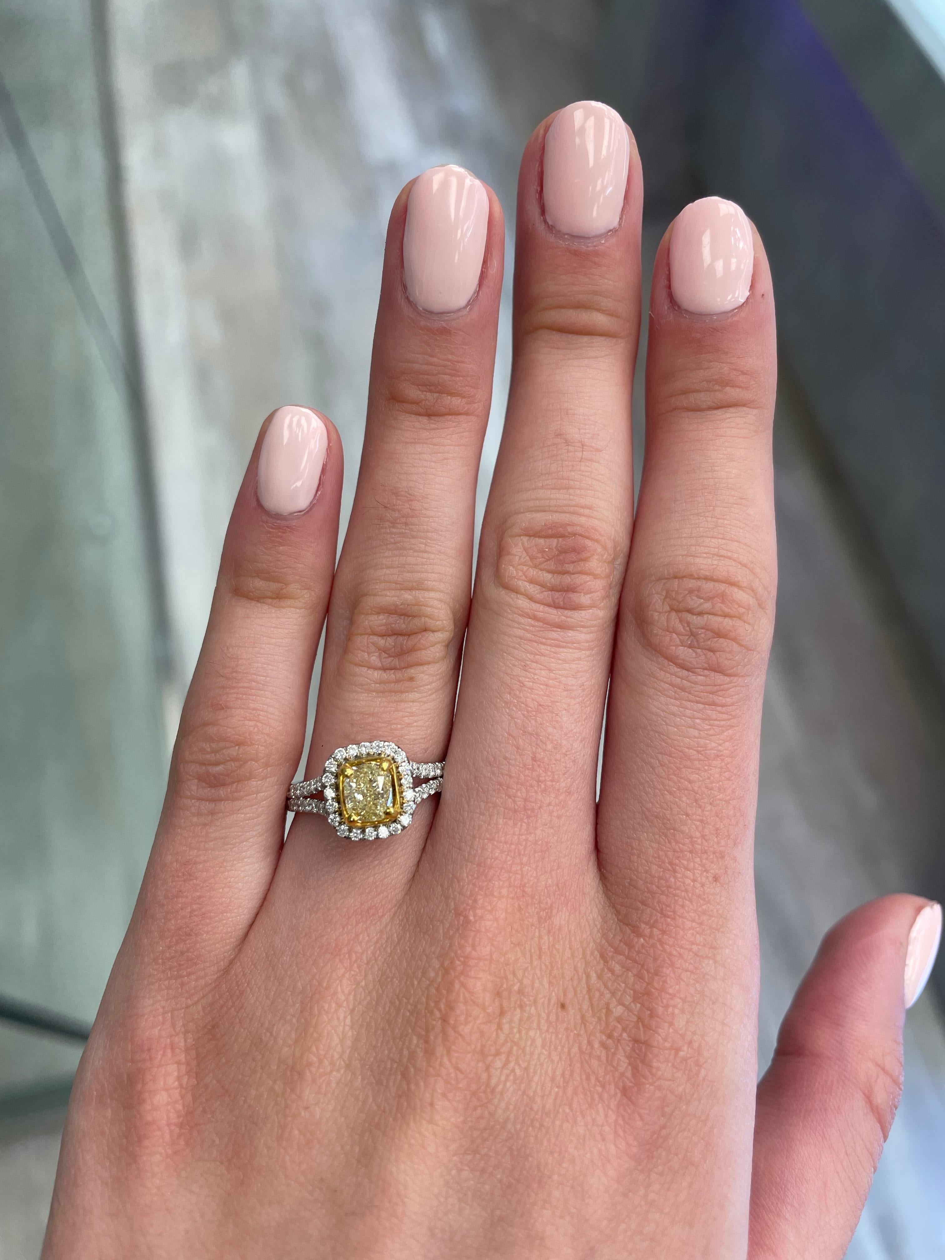 Stunning modern EGL certified yellow diamond with halo ring, two-tone 18k yellow and white gold. By Alexander Beverly Hills
1.46 carats total diamond weight.
1.00 carat cushion cut Fancy Intense Yellow color and VS2 clarity diamond, EGL graded.