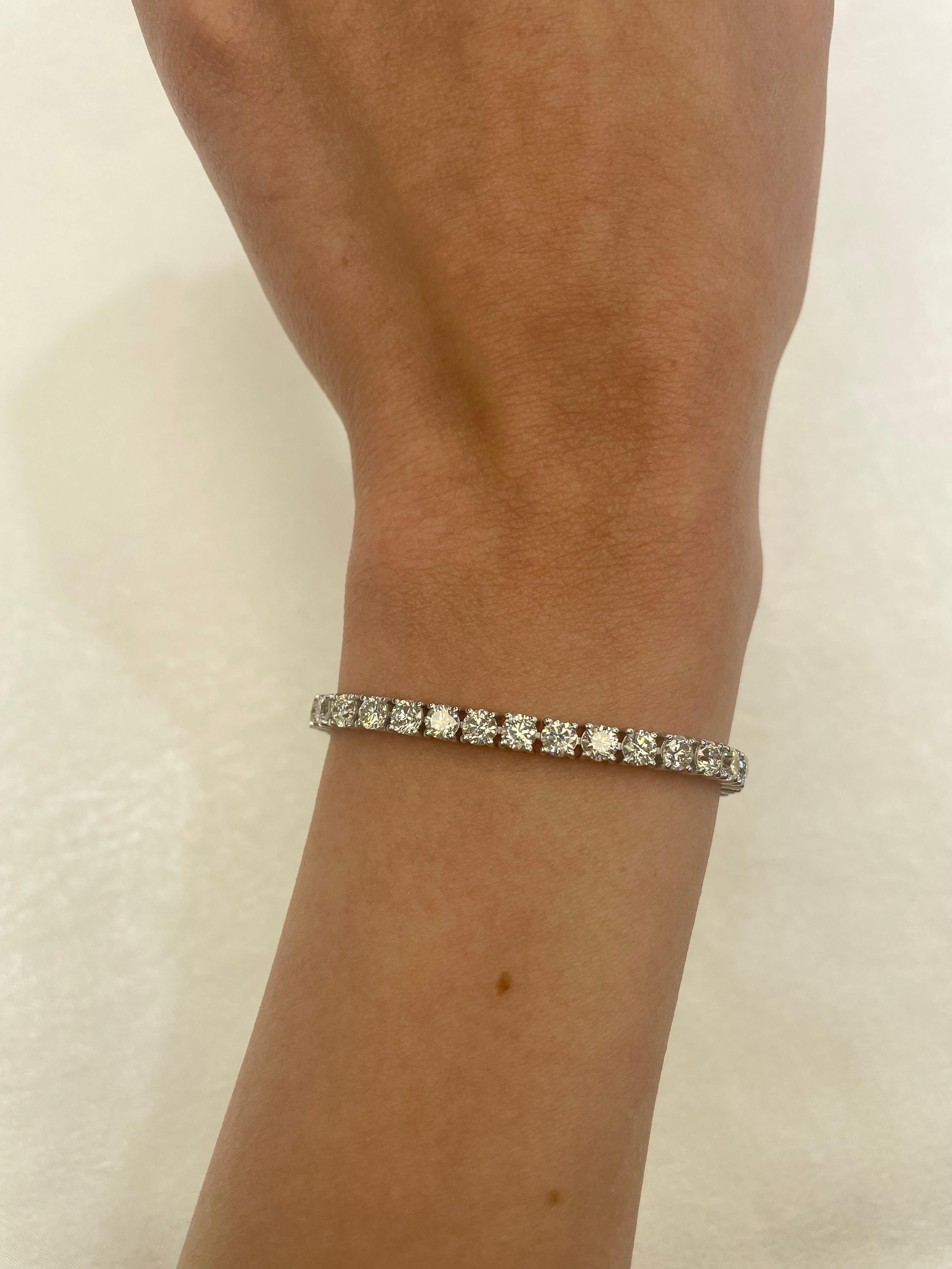 Exquisite and timeless diamonds tennis bracelet, by Alexander Beverly Hills.
42 round brilliant diamonds, 10.19 carats total. Approximately G/H color and VS clarity. Four prong set in 18k white gold, 12.16 grams, 7 inches. 
Accommodated with an up