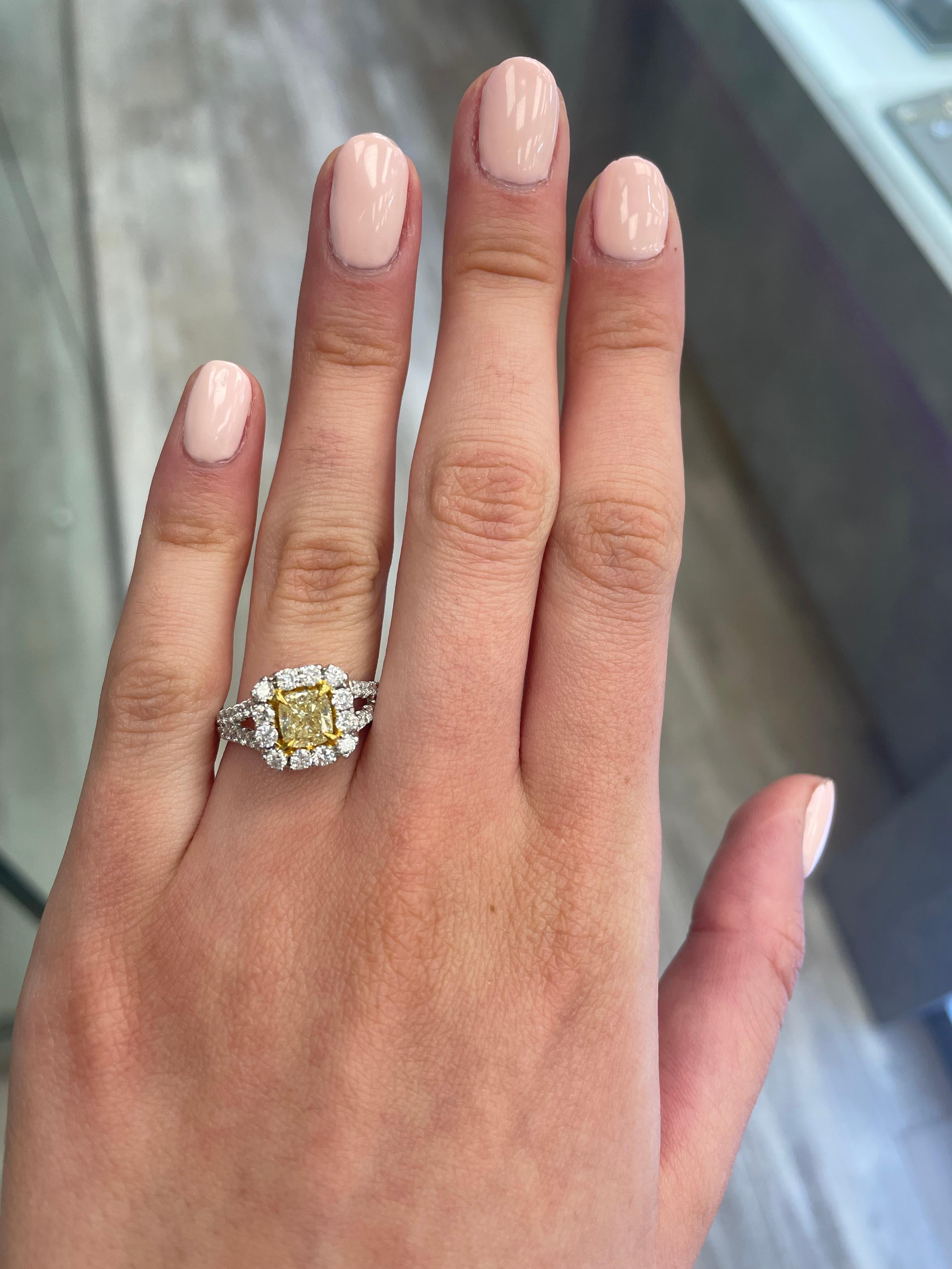 Stunning modern EGL certified yellow diamond with halo ring, two-tone 18k yellow and white gold. By Alexander Beverly Hills
2.03 carats total diamond weight.
1.01 carat cushion cut Fancy Intense Yellow color and SI2 clarity diamond, EGL graded.