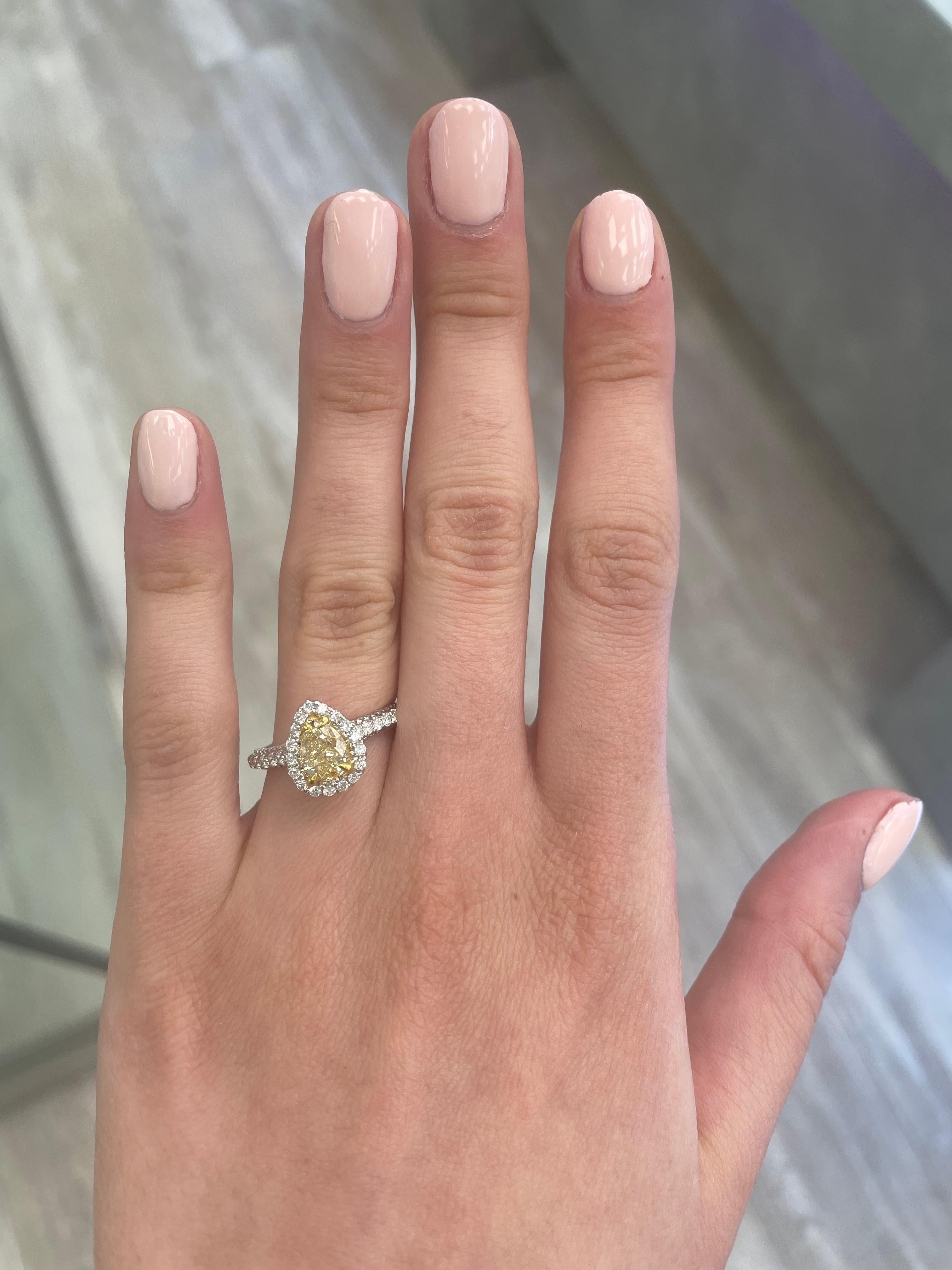 Stunning modern EGL certified yellow diamond with halo ring, two-tone 18k yellow and white gold. By Alexander Beverly Hills
1.55 carats total diamond weight.
1.01 carat pear cut Fancy Intense Yellow color and SI1 clarity diamond, EGL graded.