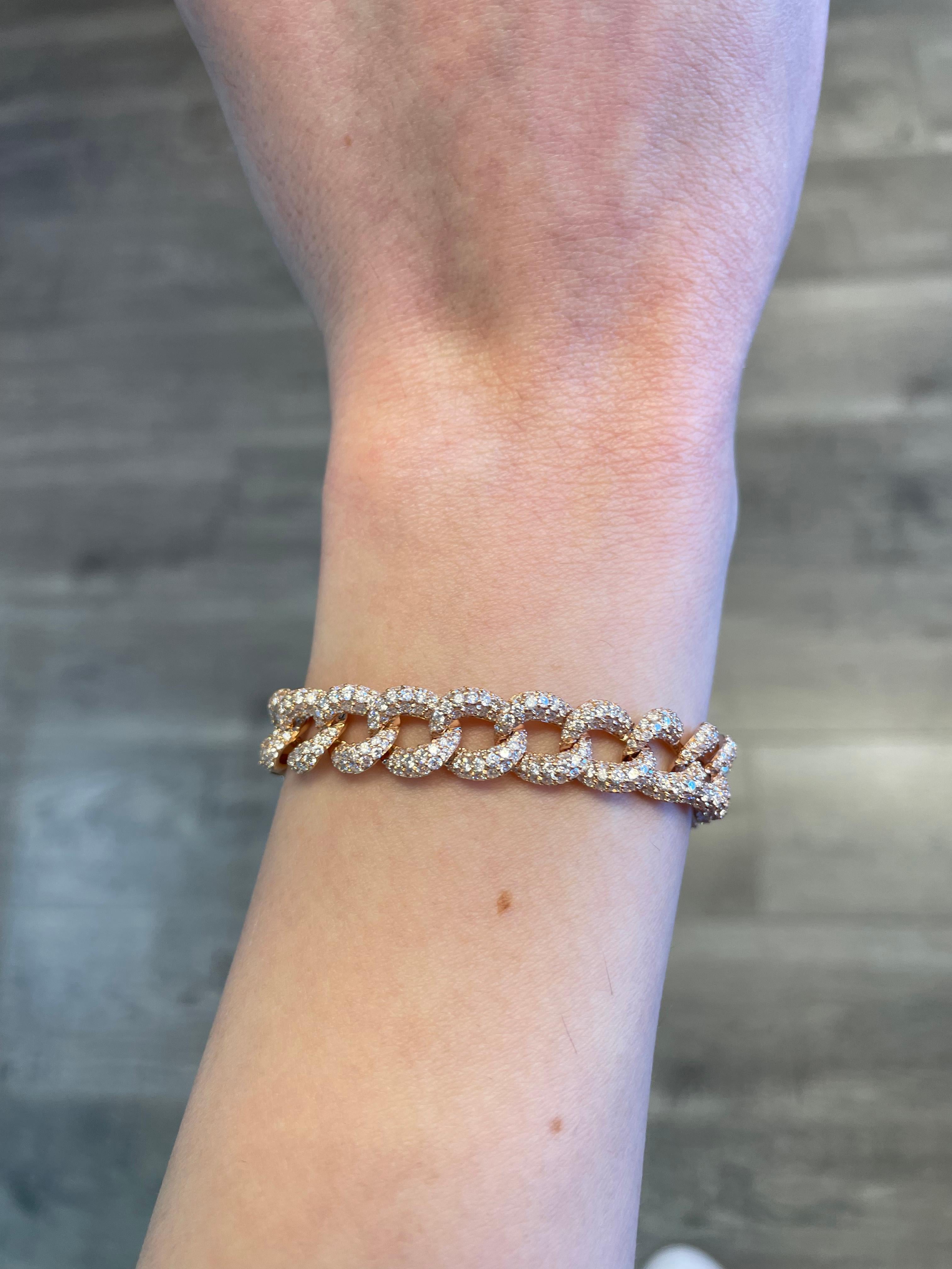 Modern diamond cuban link bracelet. High jewelry by Alexander Beverly Hills.
1290 round brilliant diamonds, 10.24 carats total. Approximately G/H color and VS2/SI1 clarity. 18k rose gold, 46.30 grams, and 12mm width.
Accommodated with an up-to-date