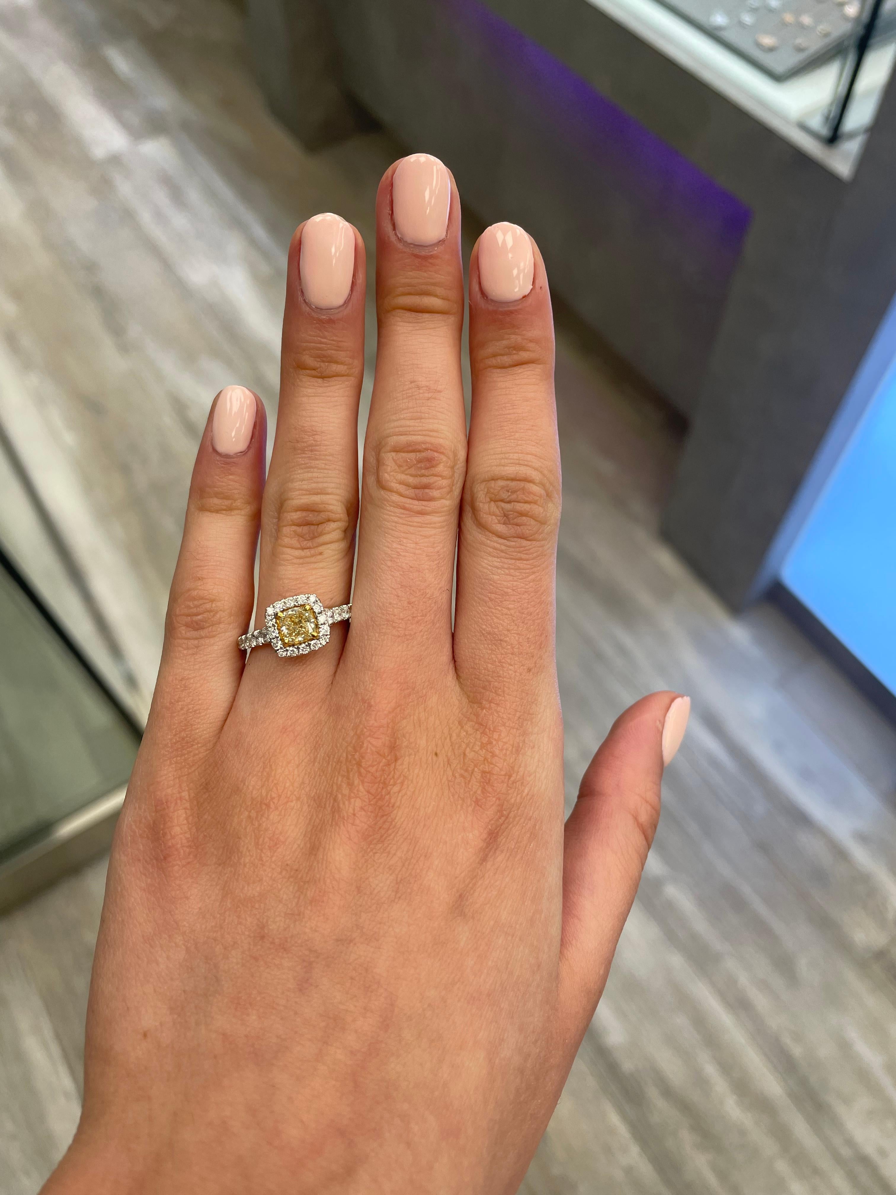 Stunning modern EGL certified yellow diamond with halo ring, two-tone 18k yellow and white gold. By Alexander Beverly Hills
1.63 carats total diamond weight.
1.02 carat cushion cut Fancy Intense Yellow color and SI1 clarity diamond, EGL graded.