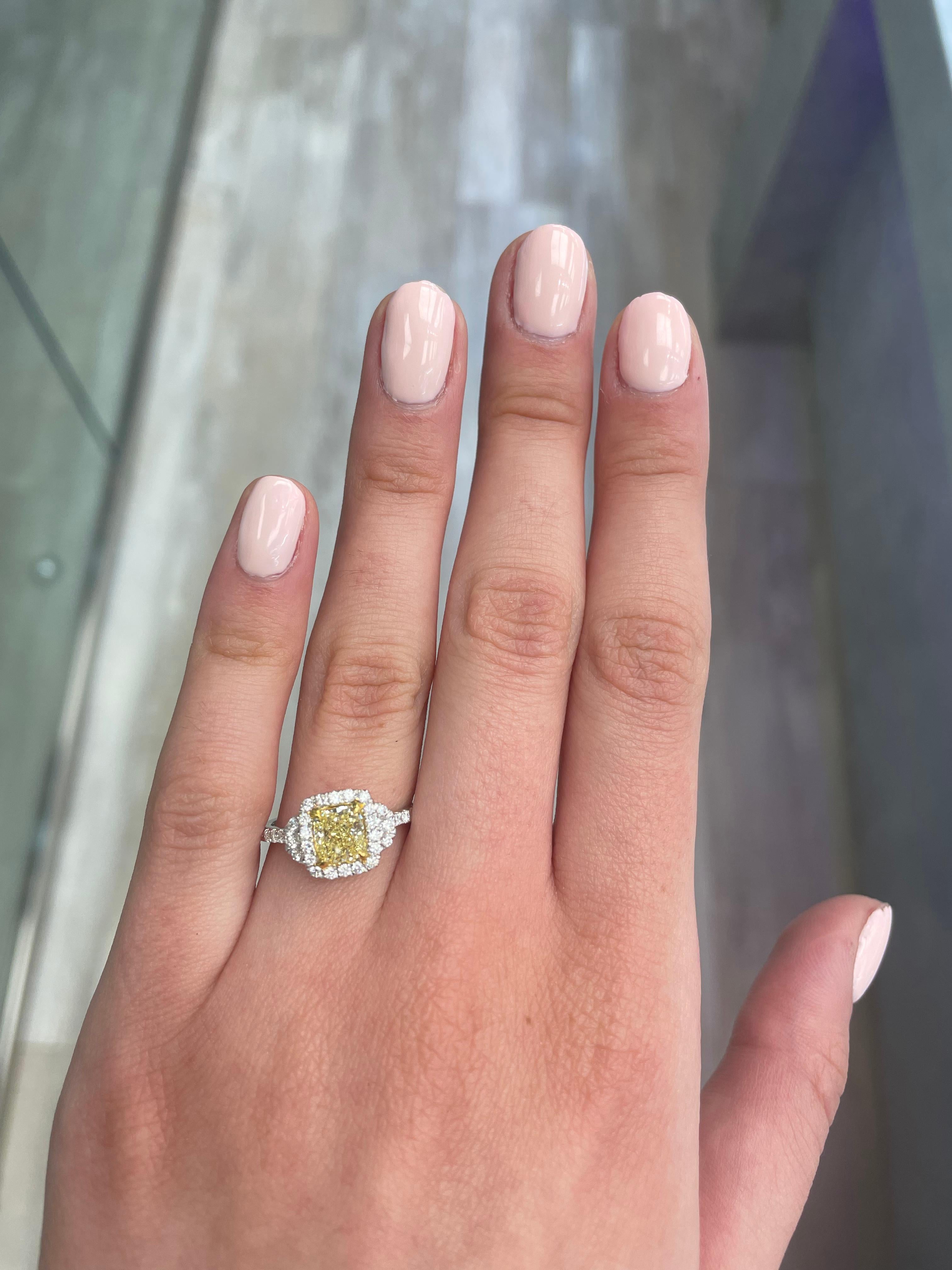 Stunning modern EGL certified yellow diamond with halo ring, two-tone 18k yellow and white gold. By Alexander Beverly Hills
1.50 carats total diamond weight.
1.07 carat cushion cut Fancy Intense Yellow color and SI2 clarity diamond, EGL graded.