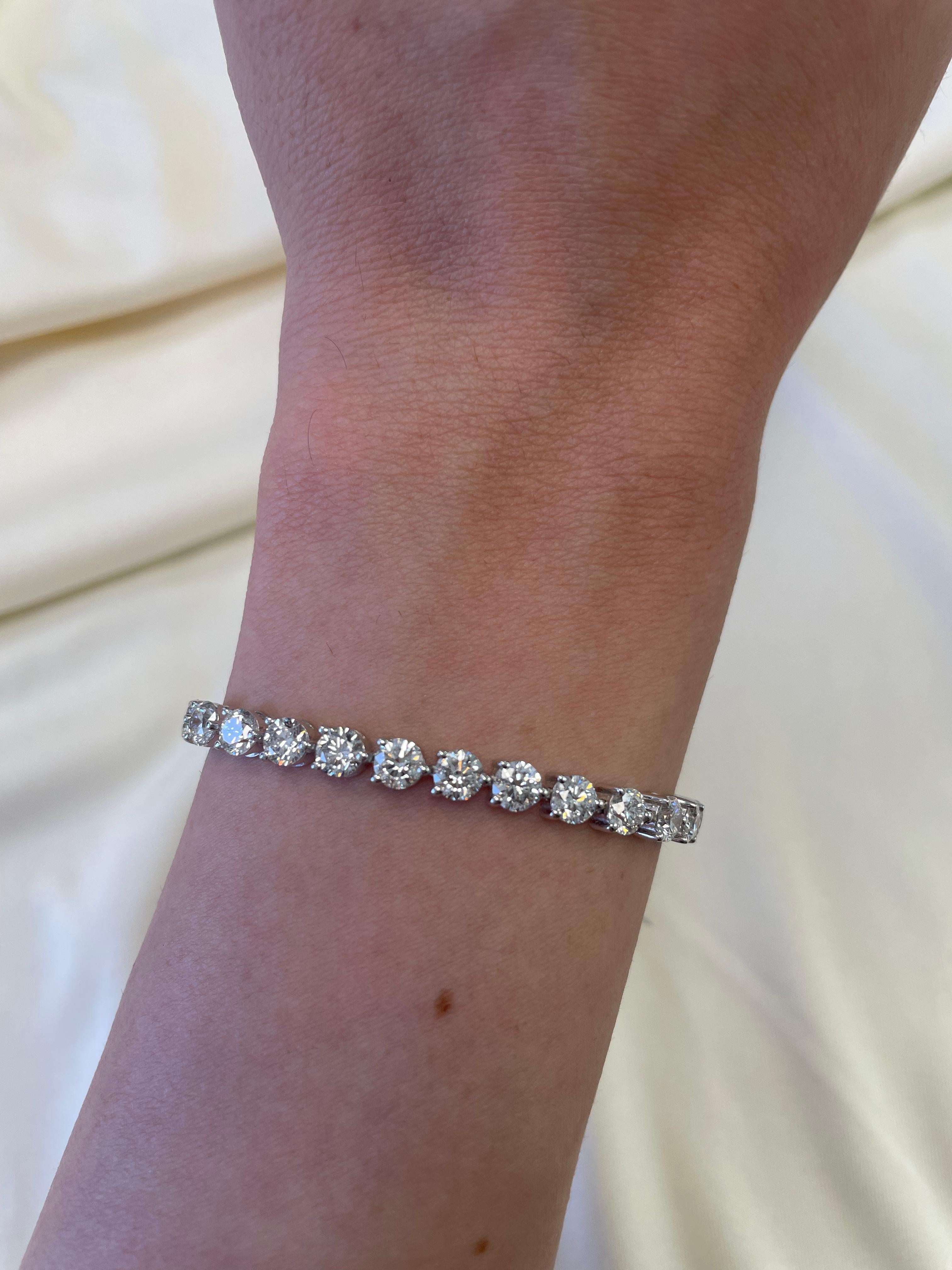 Beautiful and classic diamond tennis bracelet, by Alexander Beverly Hills.
35 round brilliant diamonds, 10.85 carats. Approximately E/F color and SI clarity. 14k white gold, 12.27 grams, three prong set, 7in.
Accommodated with an up-to-date digital