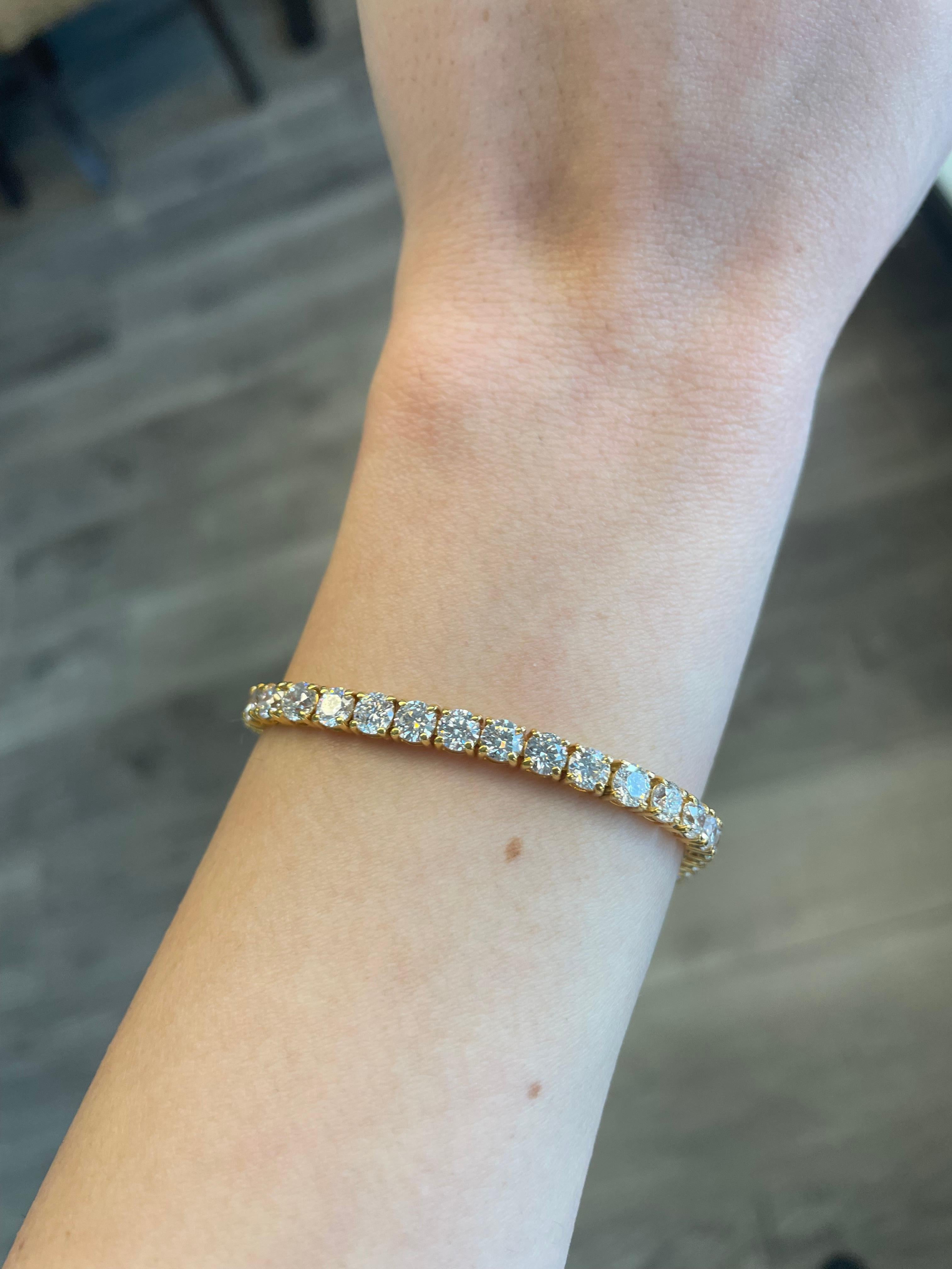 Exquisite and timeless diamonds tennis bracelet. By Alexander Beverly Hills.
44 round brilliant diamonds, 10.87 carats total. Approximately G/H color and SI clarity. Four prong set in 18k yellow gold. 
Accommodated with an up-to-date appraisal by a