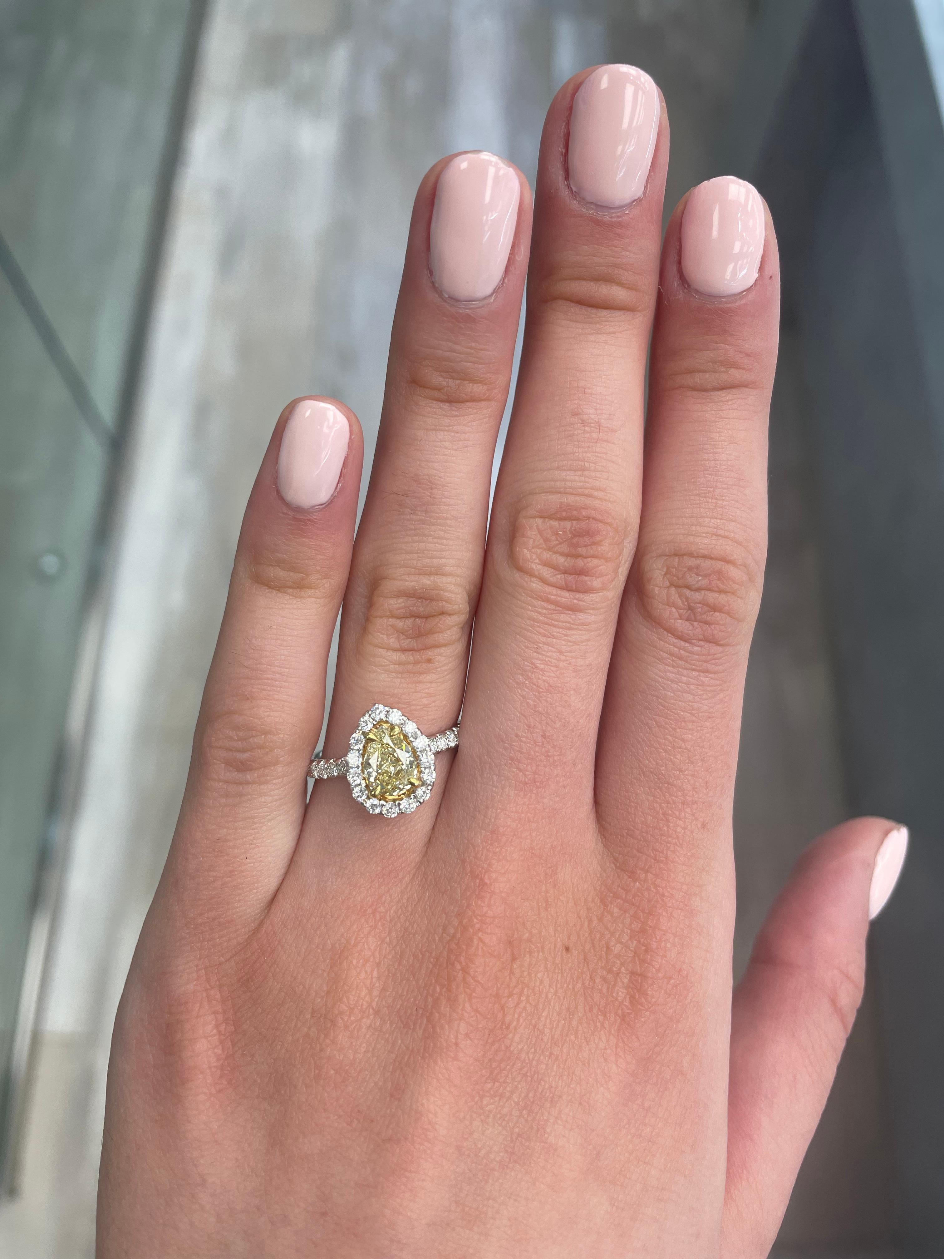 Stunning modern EGL certified yellow diamond with halo ring, two-tone 18k yellow and white gold. By Alexander Beverly Hills
1.62 carats total diamond weight.
1.08 carat pear cut Fancy Intense Yellow color and SI2 clarity diamond, EGL graded.