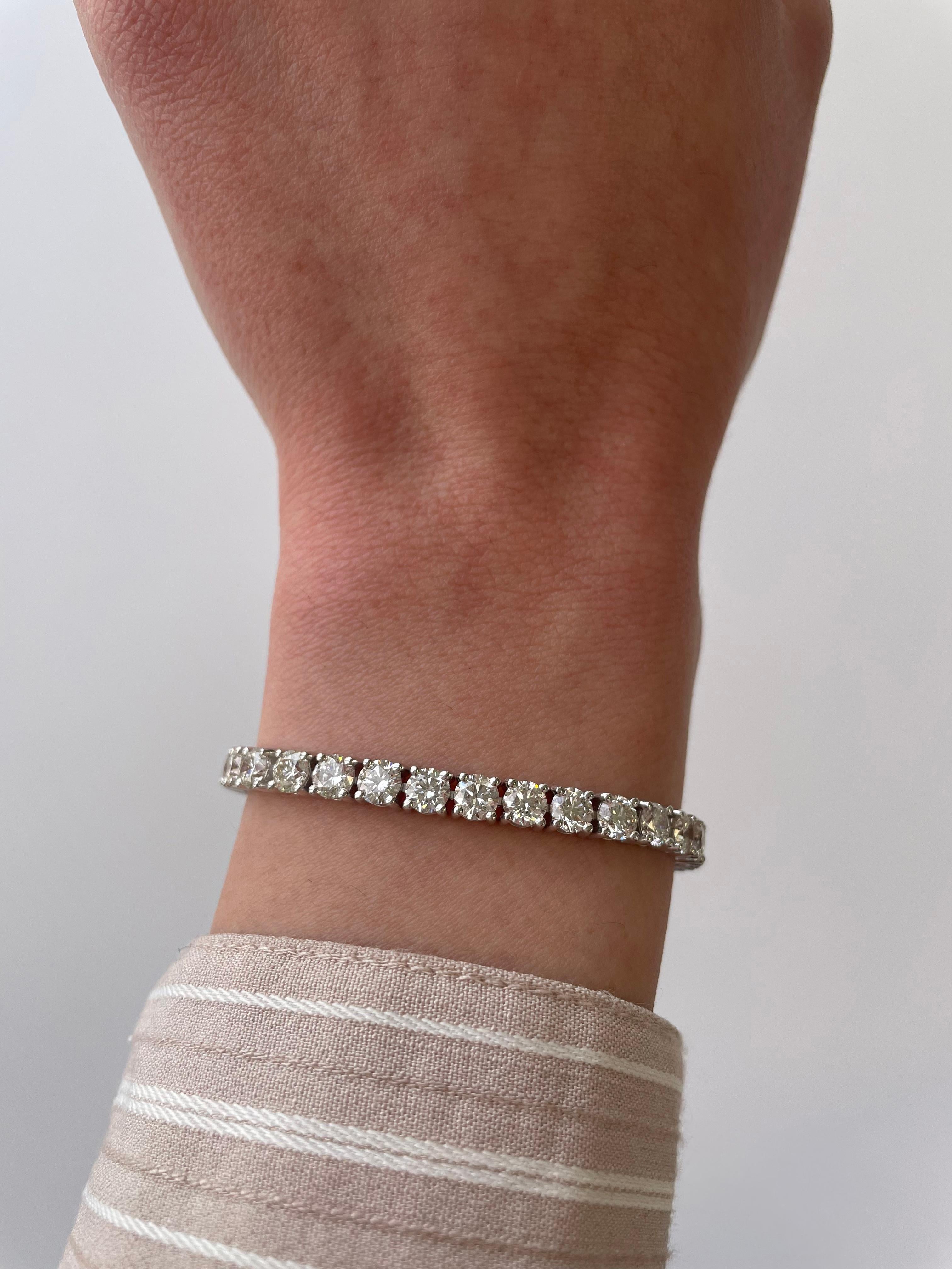 Exquisite and timeless diamonds tennis bracelet, by Alexander Beverly Hills.
38 round brilliant diamonds, 10.95 carats. Approximately F/G color and VS2/SI1 clarity. Four prong set in 18k white gold, 14.21 grams, 7 inches. 
Accommodated with an