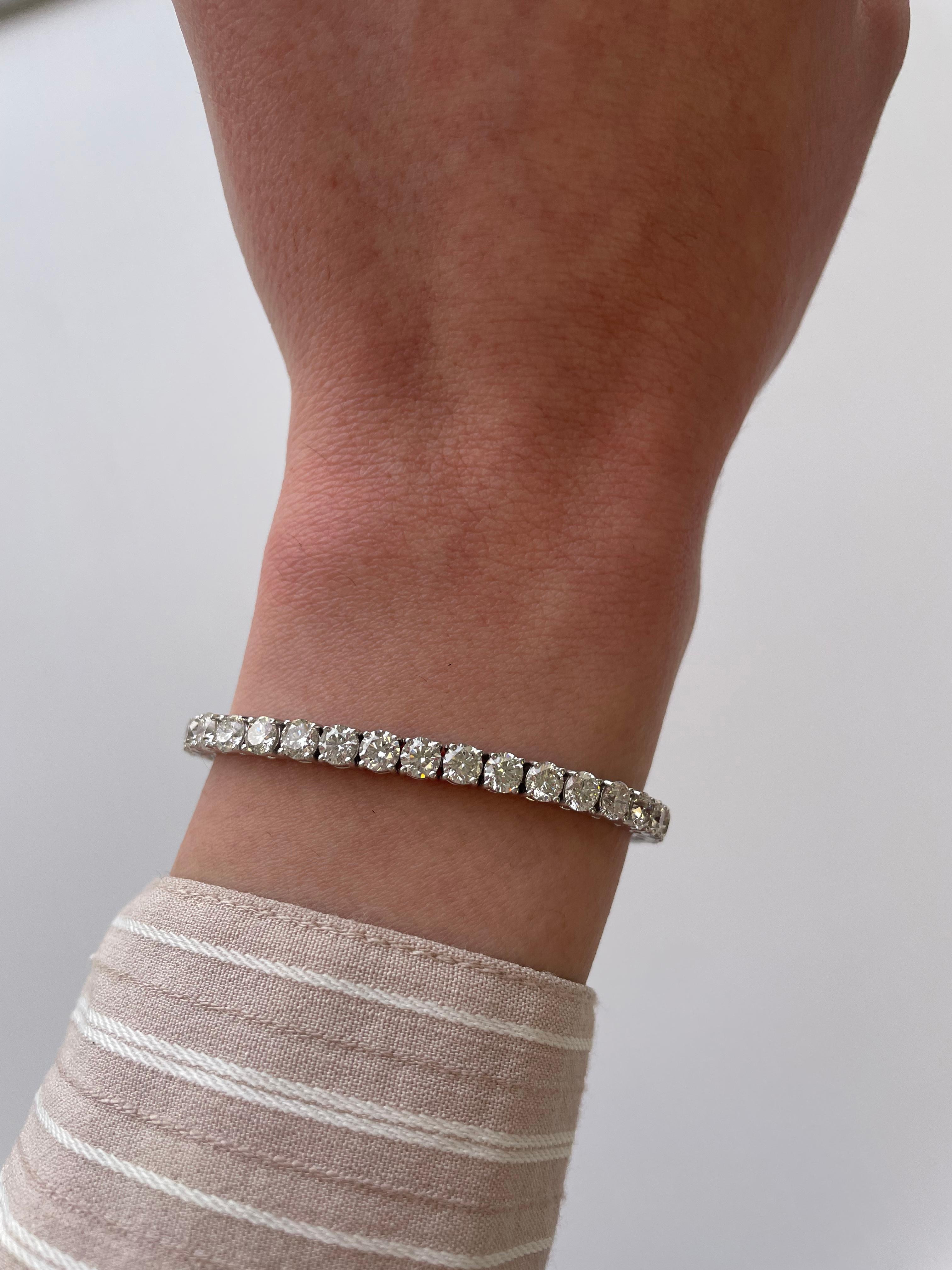 Exquisite and timeless diamonds tennis bracelet, by Alexander Beverly Hills.
45 round brilliant diamonds, 11.03 carats. Approximately D-F color and SI clarity. Four prong set in 18k white gold, 9.76 grams, 7 inches. 
Accommodated with an up-to-date