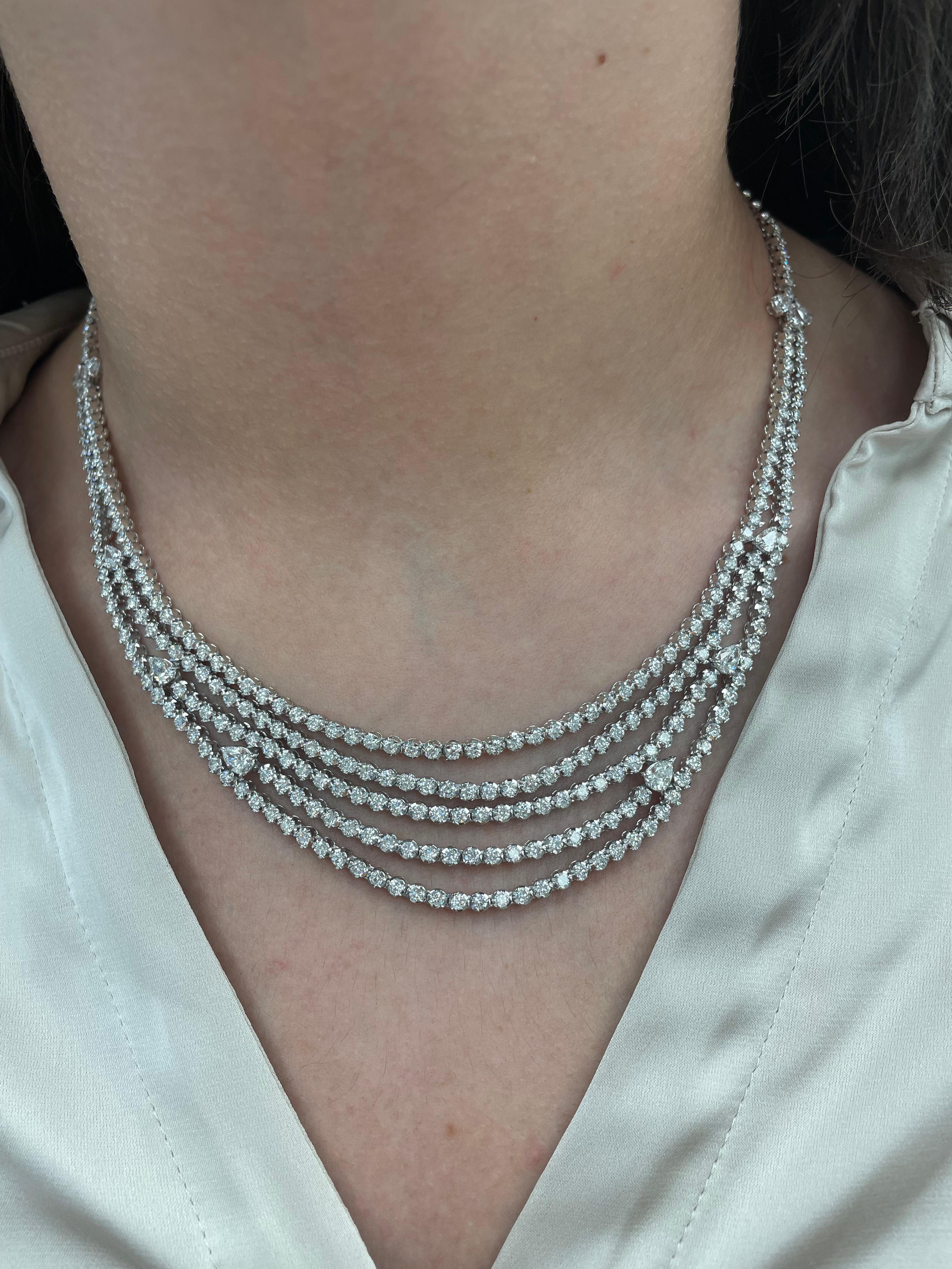 Sensational 3 row diamond tennis necklace. High jewelry by Alexander of Beverly Hills.
A big look for the value. 
12 center pear shape diamonds, 2.24 carats. Approximately F/G color and VVS1/VVS2 clarity. 258 round brilliant diamonds, 9.69 carats.