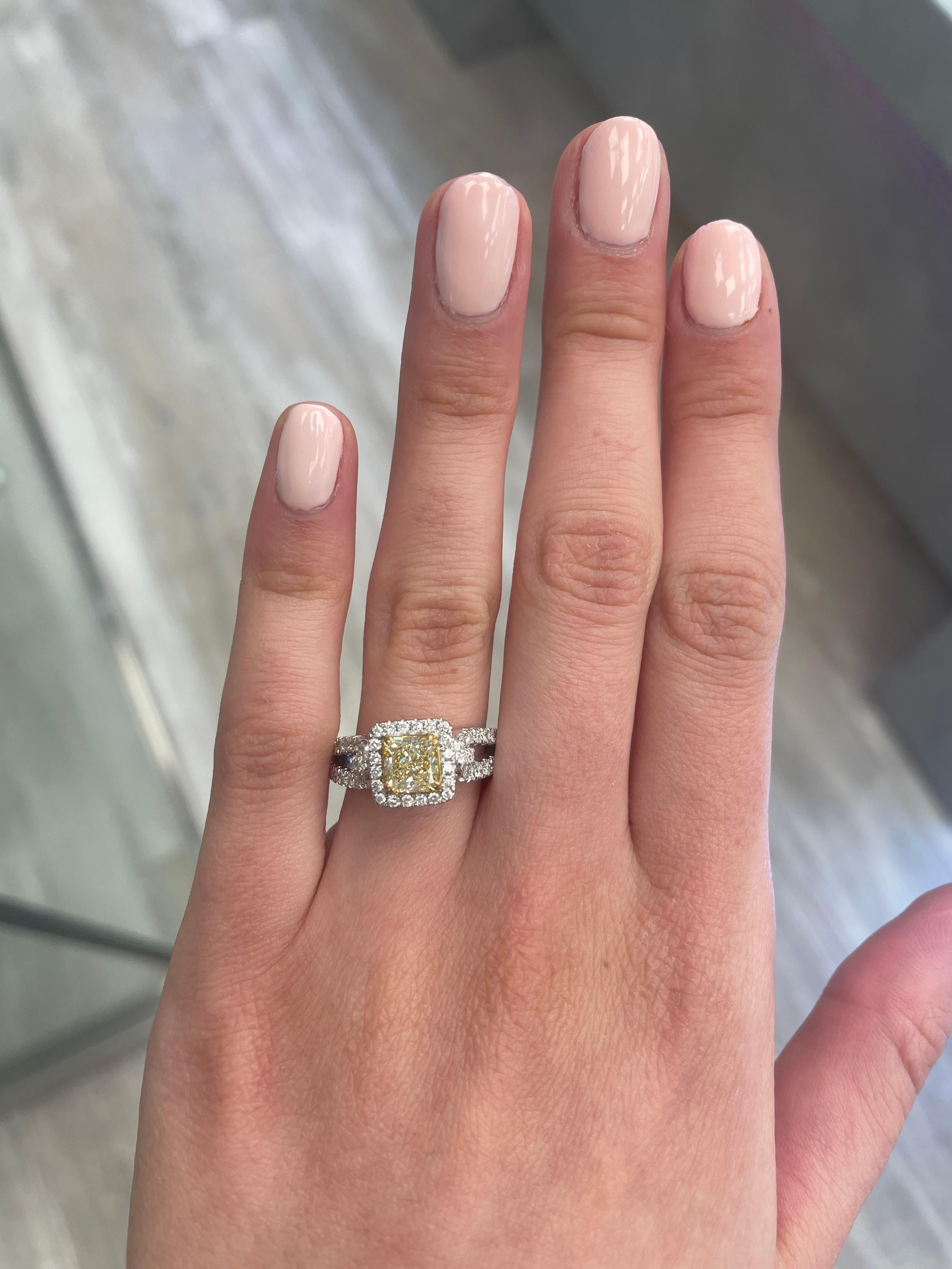 Stunning modern EGL certified yellow diamond with halo ring, two-tone 18k yellow and white gold, split shank. By Alexander Beverly Hills
1.97 carats total diamond weight.
1.19 carat radiant cut Fancy Intense Yellow color and SI1 clarity diamond, EGL