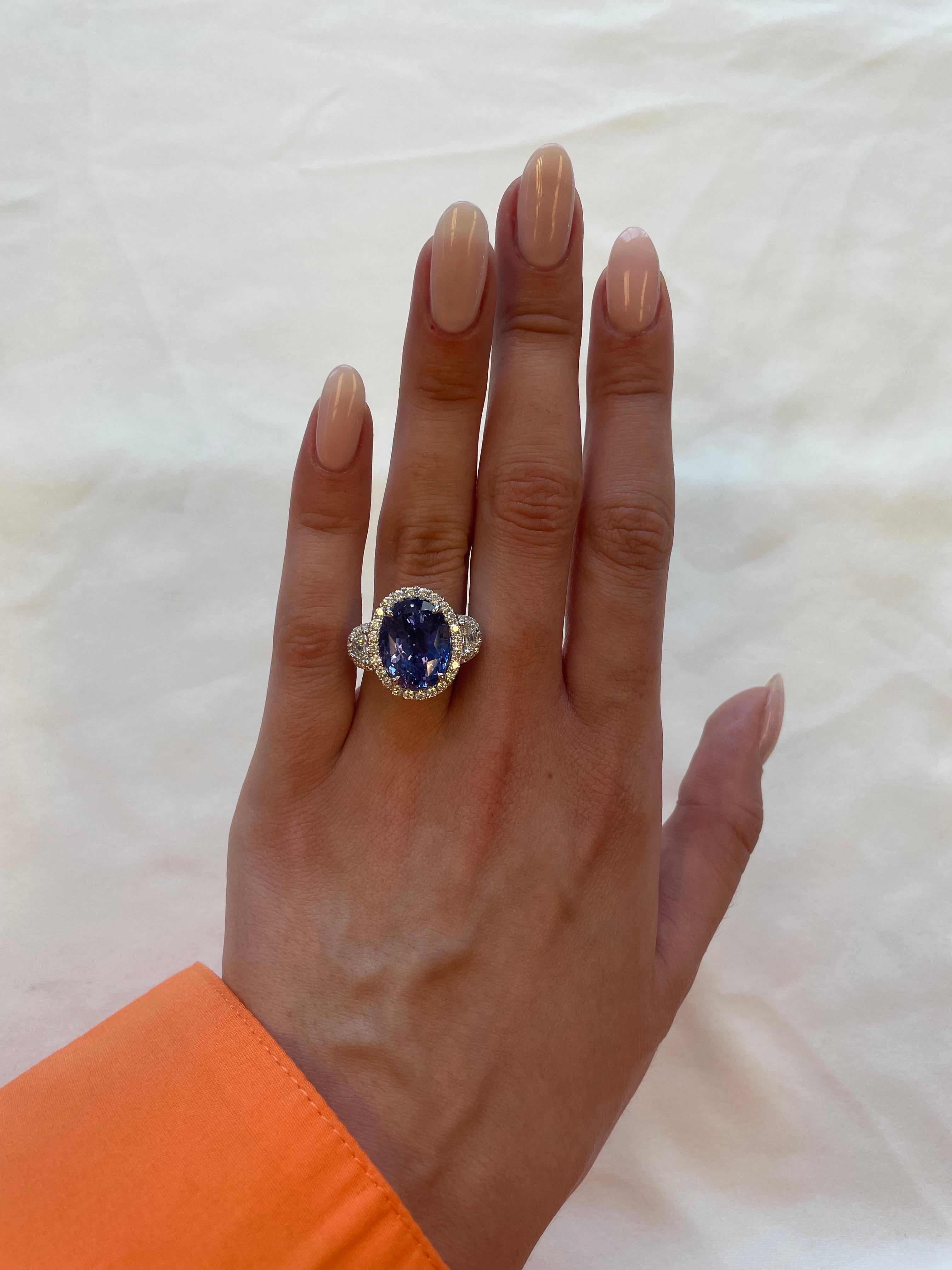 Stunning Ceylon sapphire and diamond halo ring, GIA certified. High jewelry by Alexander Beverly Hills. 
14.47 carats total gemstone weight.
GIA certified 12.05 carat oval sapphire, Sri Lanka (Ceylon) origin, no-heat. Complimented with 2 epaulette