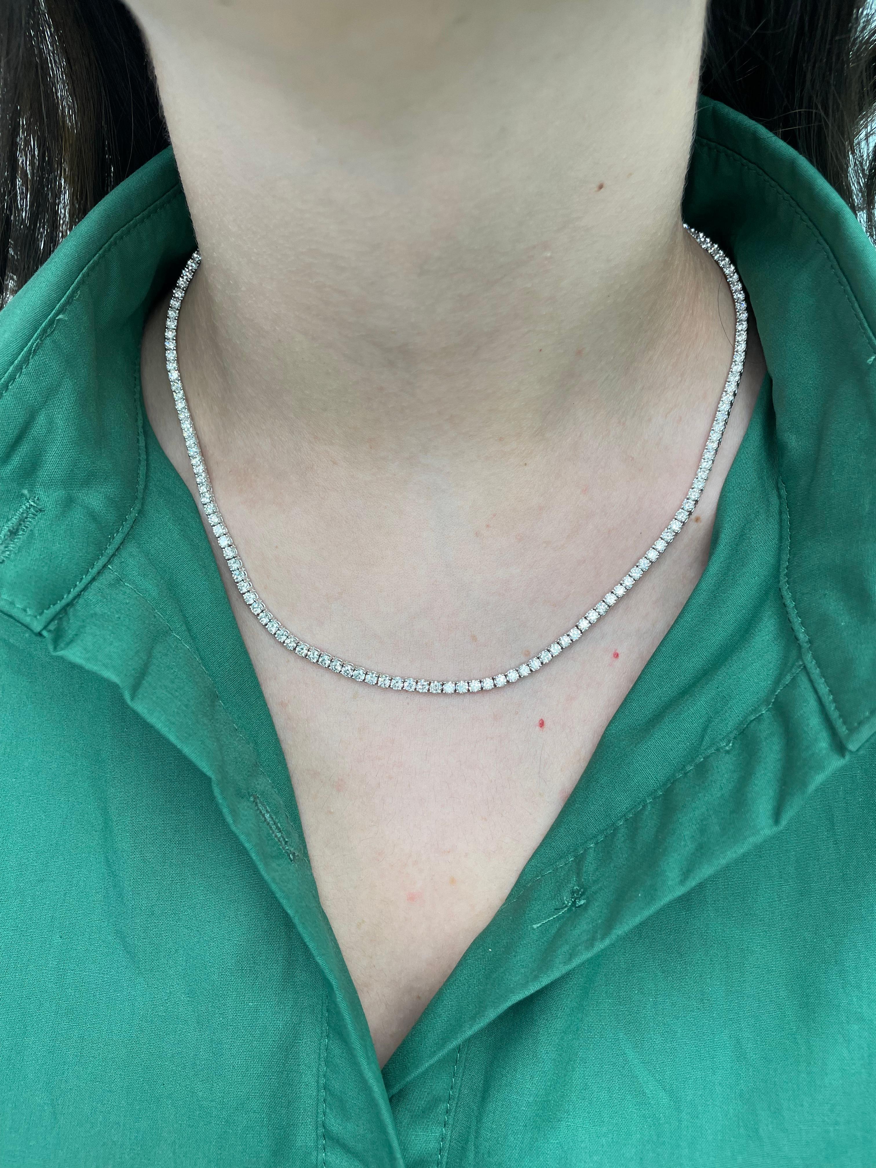 Beautiful and classic diamond tennis necklace, by Alexander Beverly Hills.
12.32 carats of round brilliant diamonds, approximately G/H color and VS clarity. 18k white gold, 13.38 grams, prong set, 18.5in.
Accommodated with an up-to-date appraisal by