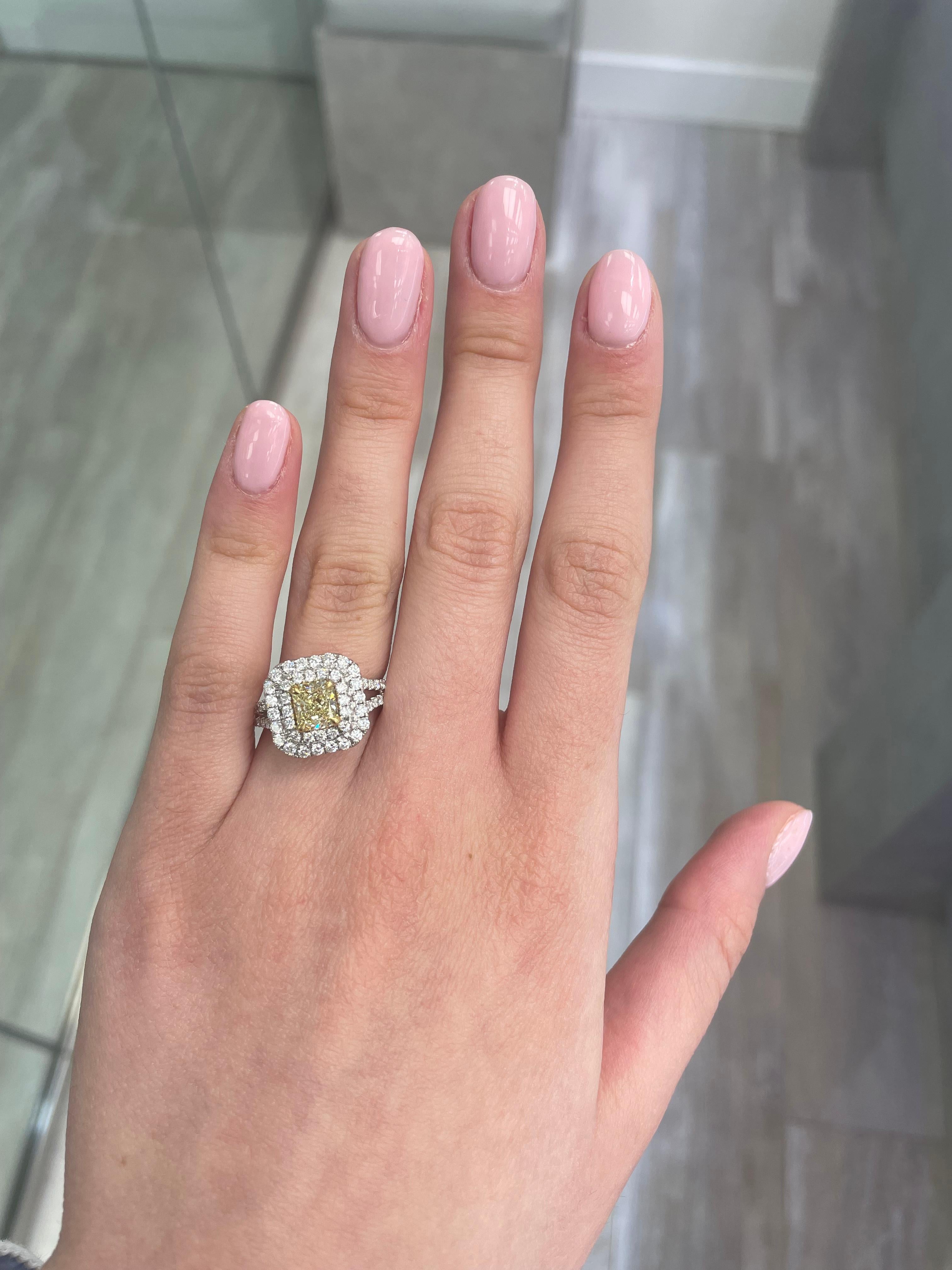 Stunning modern EGL certified fancy intense yellow diamond double halo ring, two-tone 18k yellow and white gold, split shank. By Alexander Beverly Hills
2.19 carats total diamond weight.
1.23 carat radiant cut Fancy Intense Yellow color and VS2