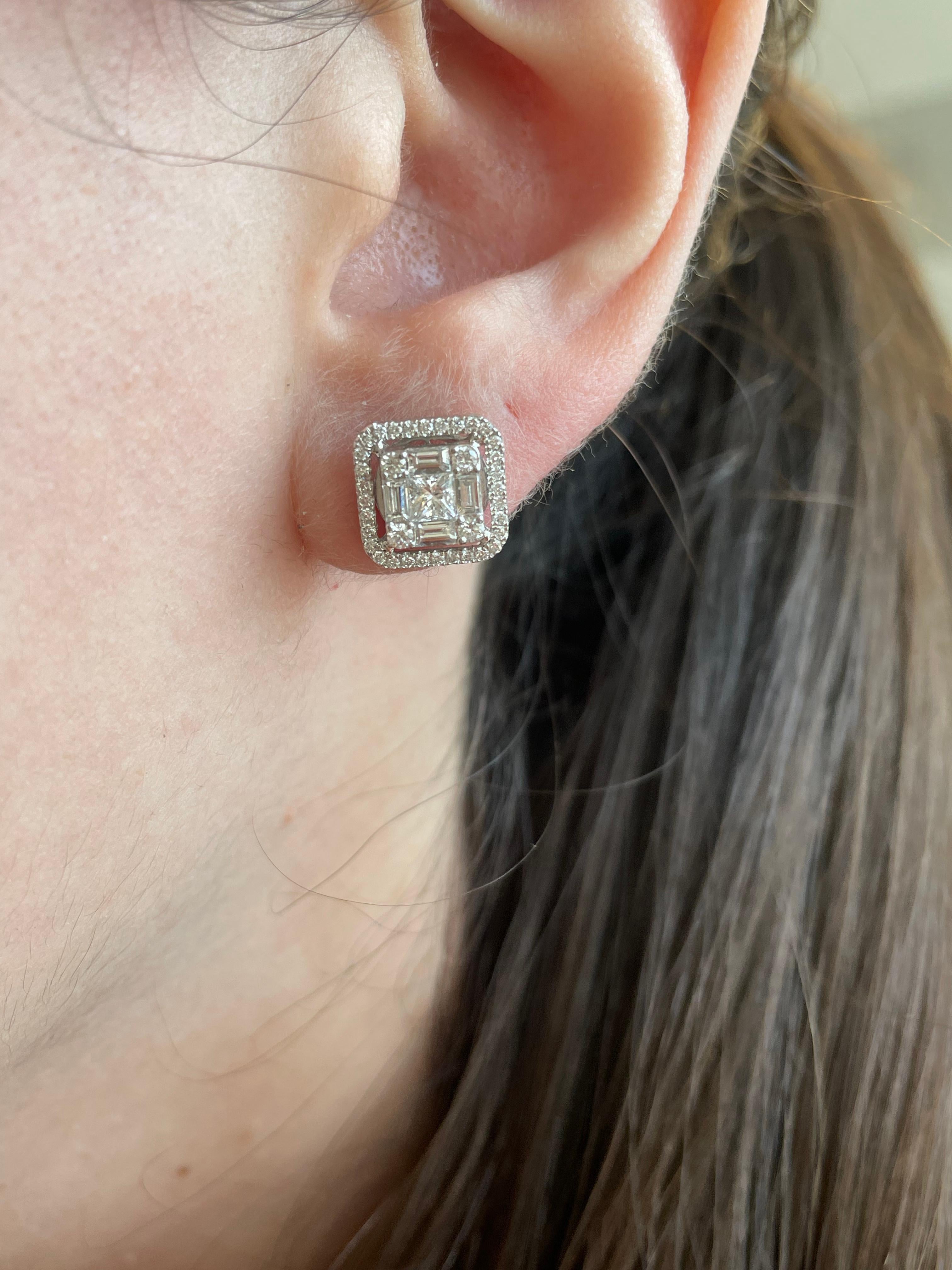 Beautiful illusion set diamond stud earrings, set to look like emerald cut diamonds. 
82 baguette, round, and princess diamonds, 1.29 carats. Approximately G/H color and VS2/SI1 clarity. 18-karat white gold, 5.58 grams. 
Accommodated with an up to