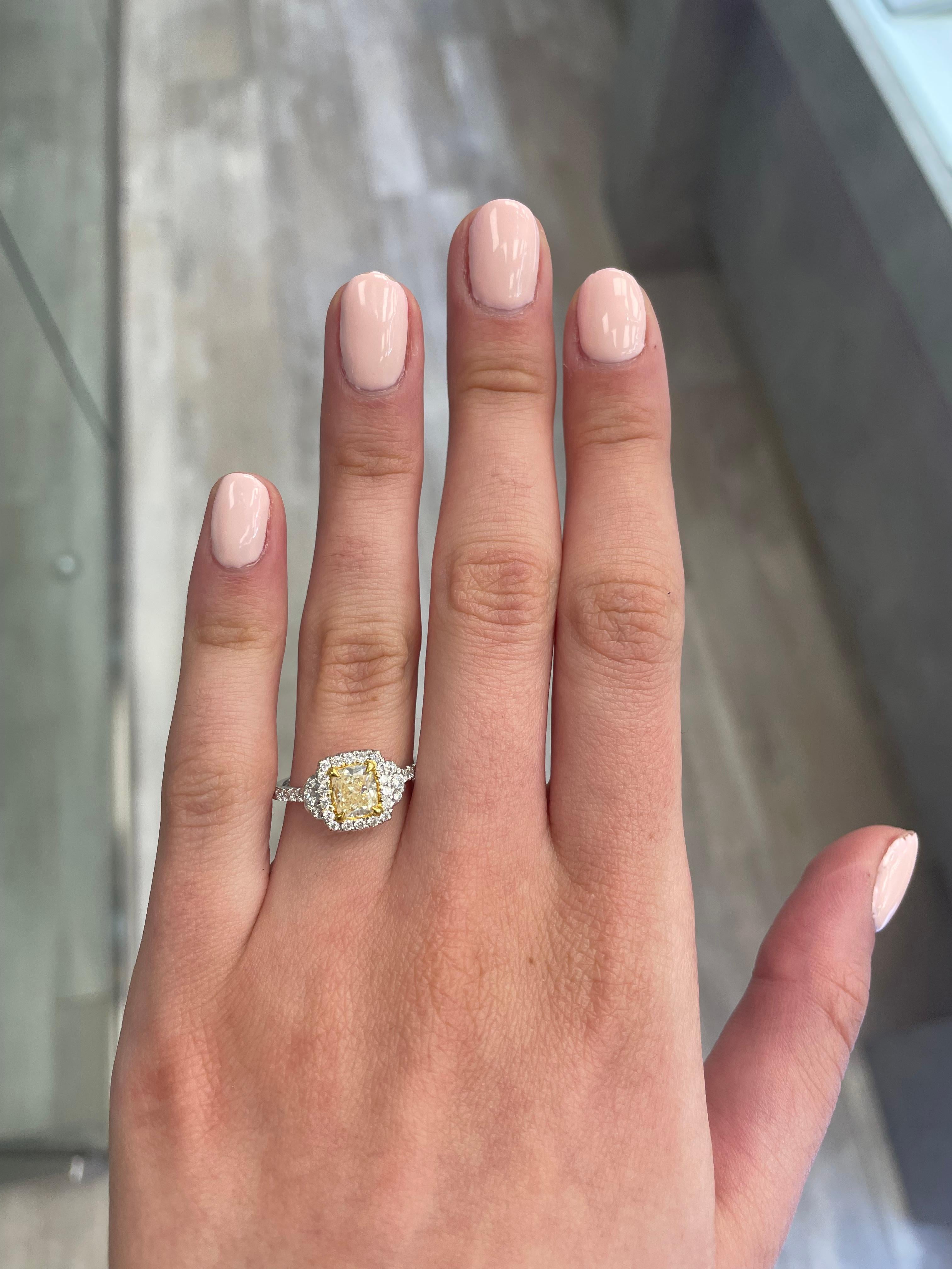 Stunning modern EGL certified yellow diamond with halo ring, two-tone 18k yellow and white gold. By Alexander Beverly Hills
1.38 carats total diamond weight.
0.96 carat cushion cut Fancy Yellow color and SI2 clarity diamond, EGL graded. Complimented