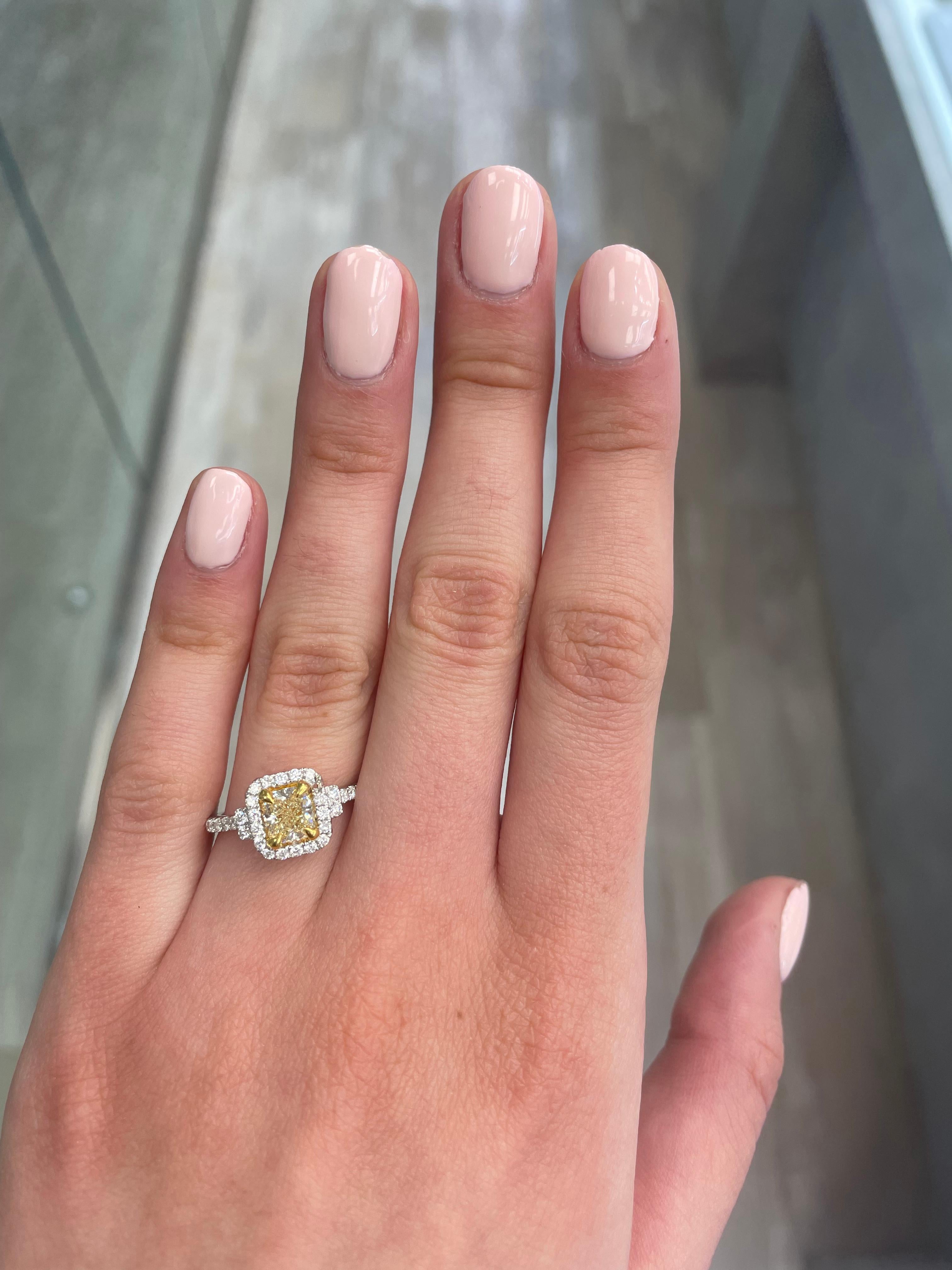 Stunning modern EGL certified yellow diamond with halo ring, two-tone 18k yellow and white gold. By Alexander Beverly Hills
1.39 carats total diamond weight.
1.00 carat cushion cut Fancy Yellow color and VS1 clarity diamond, EGL graded. Complimented