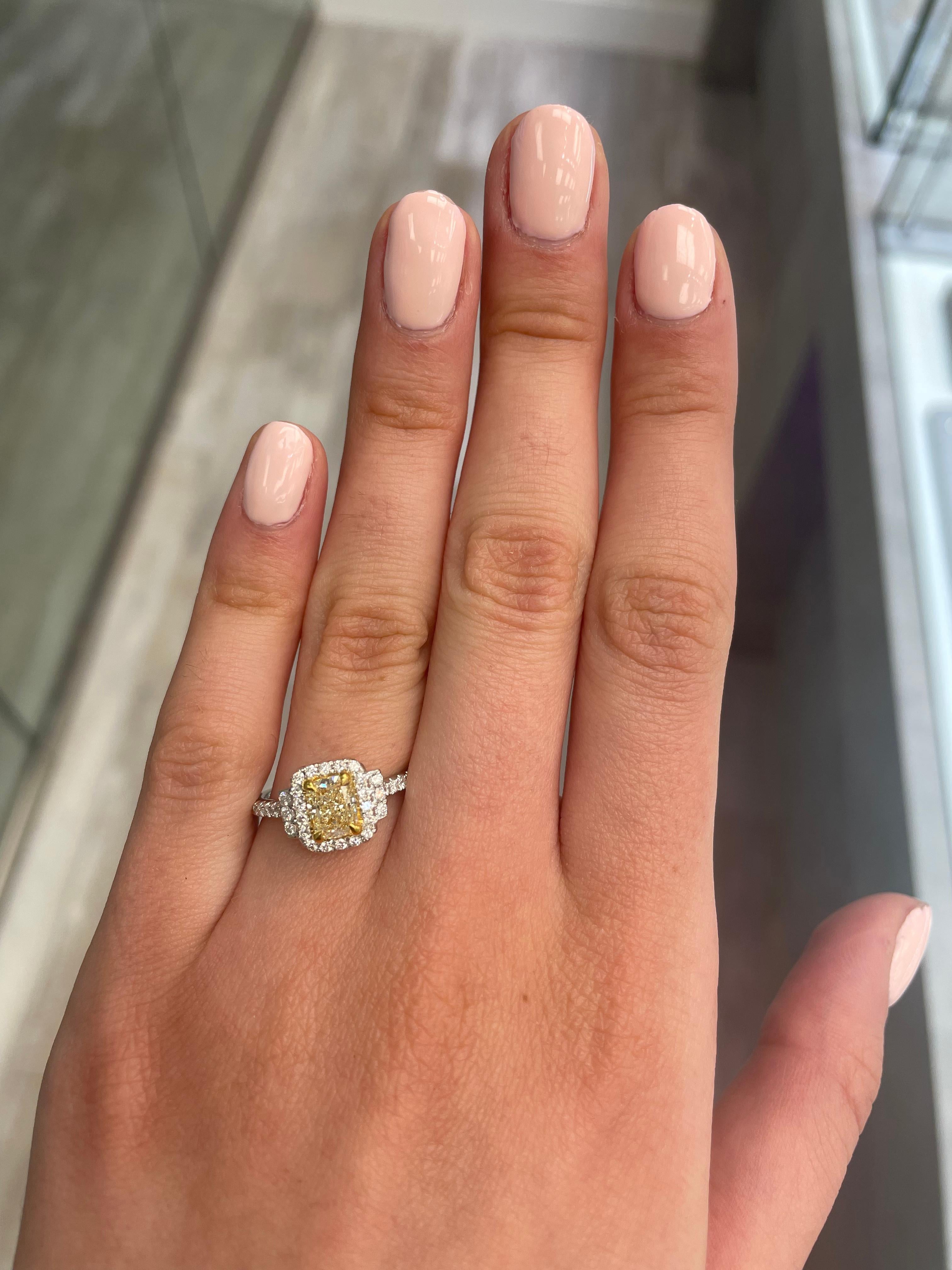 Stunning modern EGL certified yellow diamond with halo ring, two-tone 18k yellow and white gold. By Alexander Beverly Hills
1.39 carats total diamond weight.
1.01 carat cushion cut Fancy Yellow color and VS2 clarity diamond, EGL graded. Complimented