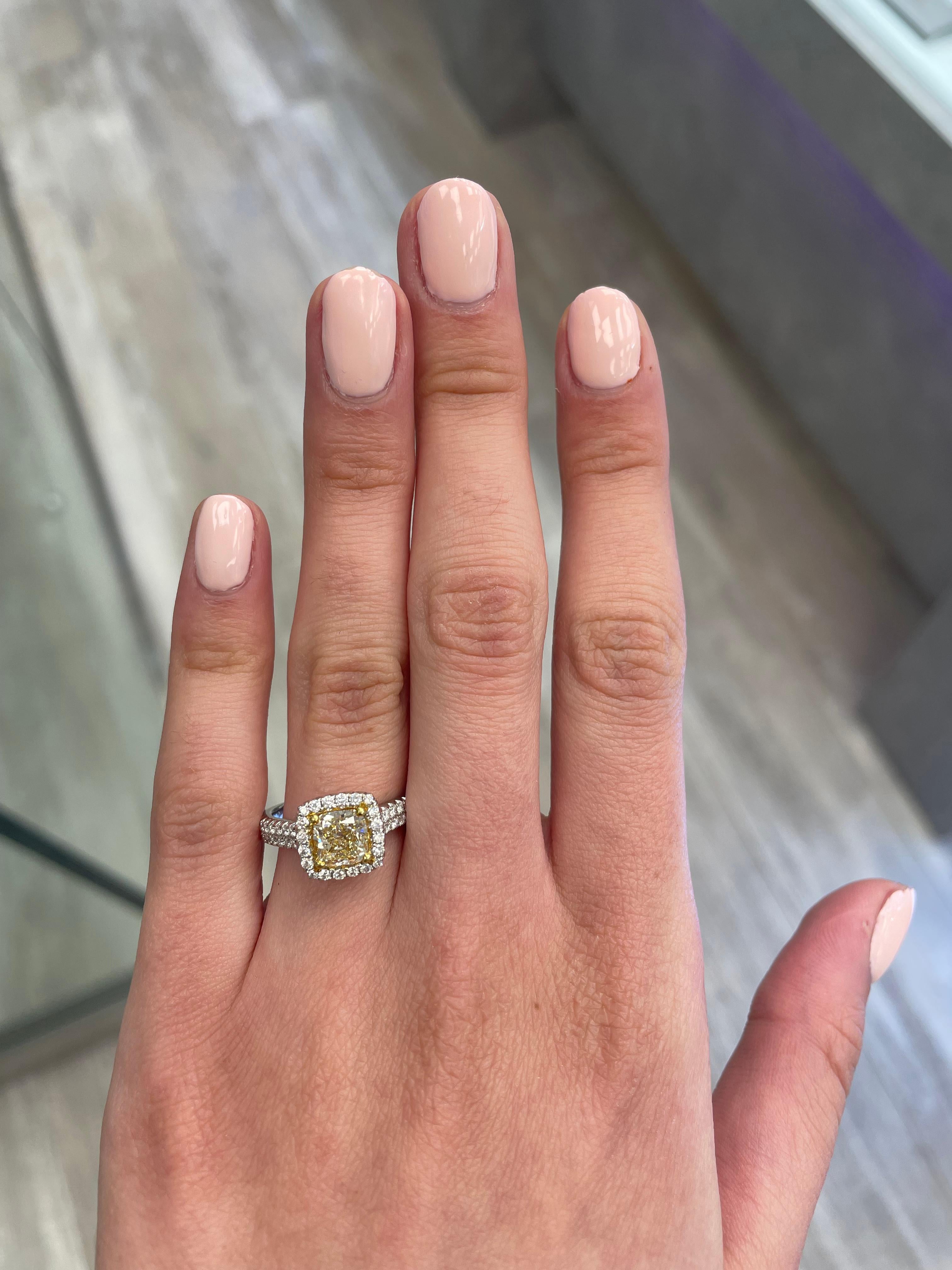 Stunning modern EGL certified yellow diamond with halo ring, two-tone 18k yellow and white gold. By Alexander Beverly Hills
2.07 carats total diamond weight.
1.41 carat cushion cut Fancy Intense Yellow color and VVS2 clarity diamond, EGL graded.