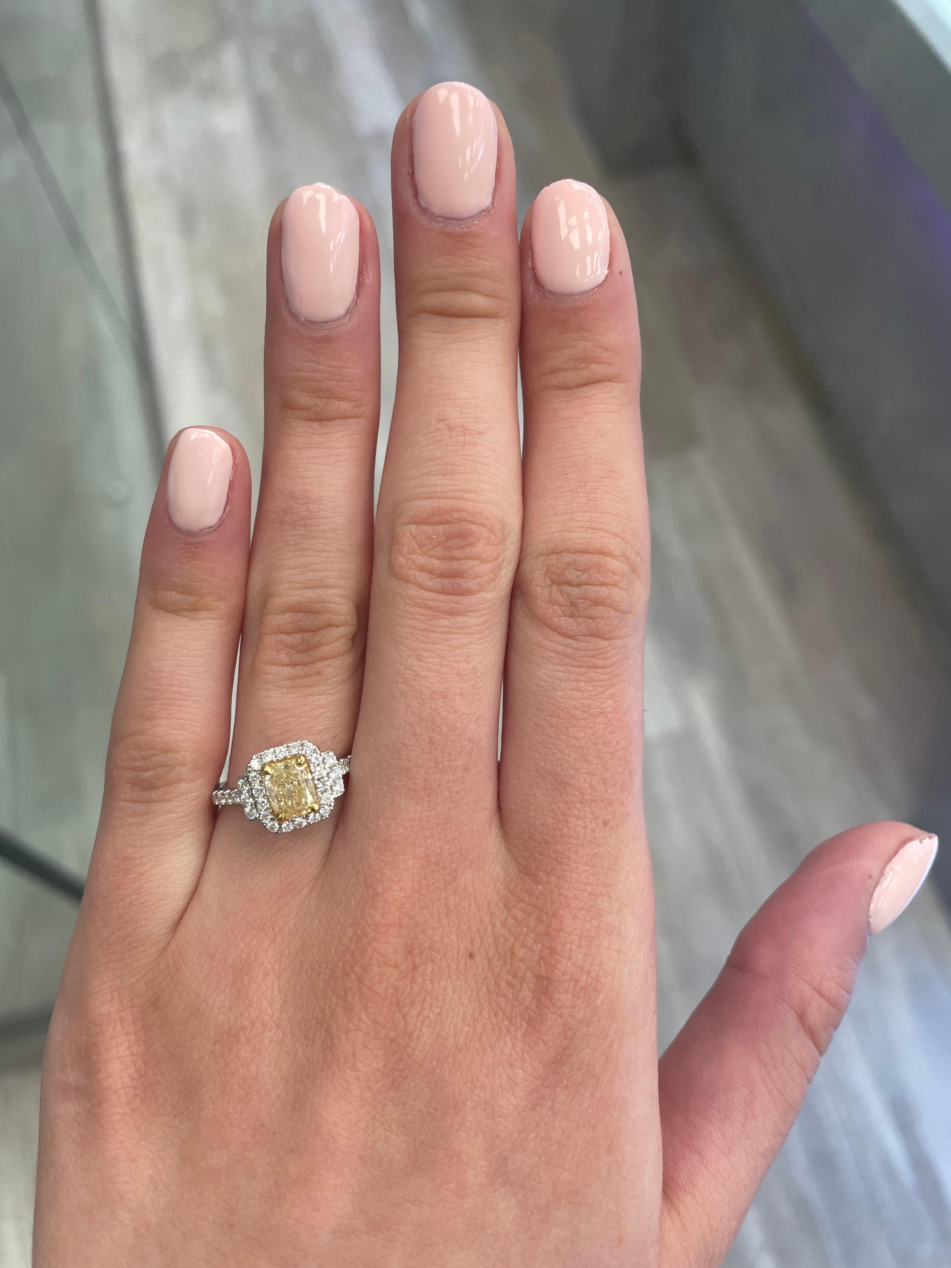 Stunning modern EGL certified yellow diamond with halo ring, two-tone 18k yellow and white gold. By Alexander Beverly Hills
1.42 carats total diamond weight.
1.04 carat cushion cut Fancy Yellow color and SI3 clarity diamond, EGL graded. Complimented