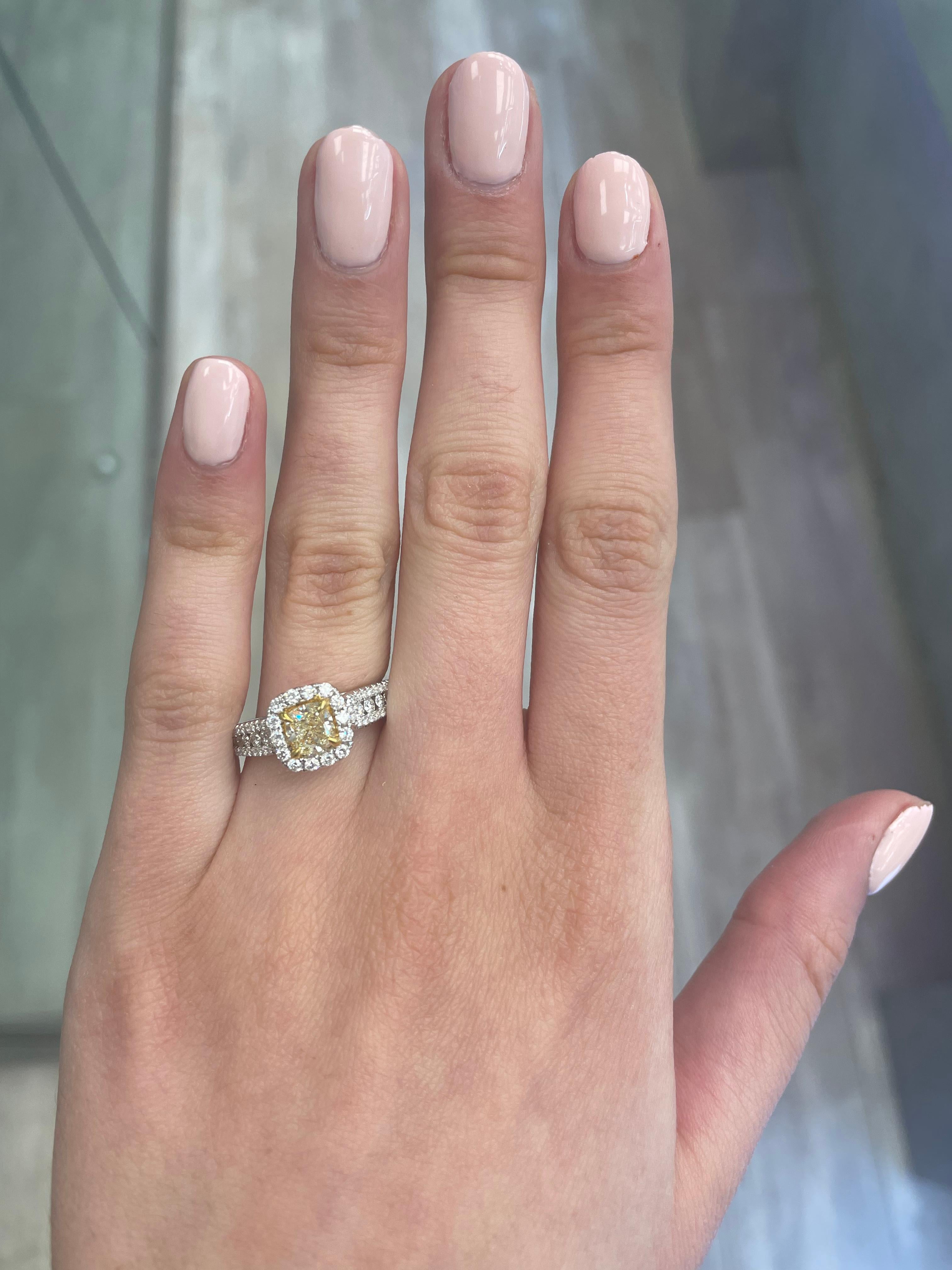 Stunning modern EGL certified yellow diamond with halo ring, two-tone 18k yellow and white gold, split shank. By Alexander Beverly Hills
1.47 carats total diamond weight.
0.91 carat cushion cut Fancy Yellow color and VS1 clarity diamond, EGL graded.