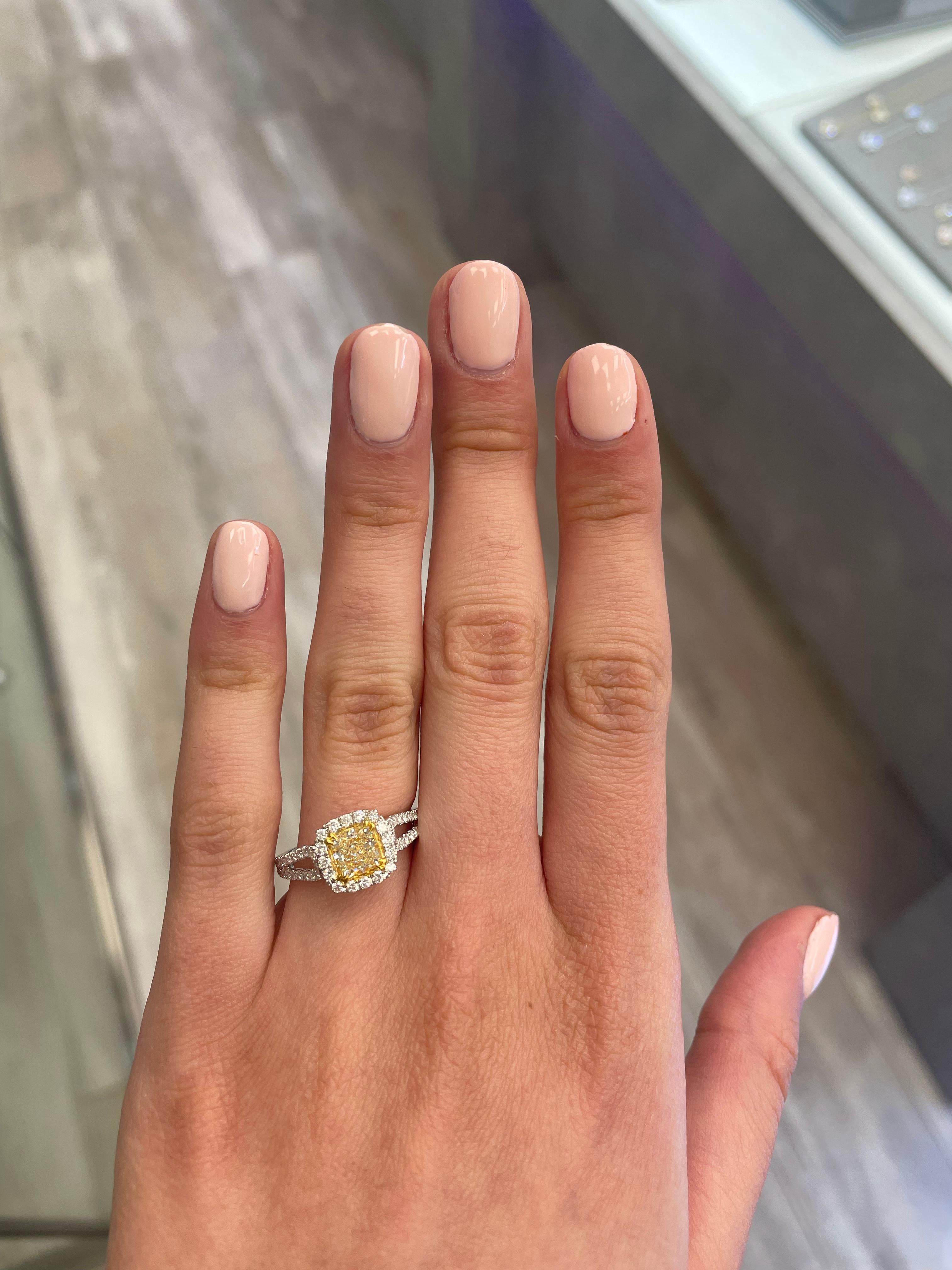 Stunning modern EGL certified yellow diamond with halo ring, two-tone 18k yellow and white gold, split shank. By Alexander Beverly Hills
1.48 carats total diamond weight.
1.05 carat cushion cut Fancy Yellow color and VS1 clarity diamond, EGL graded.