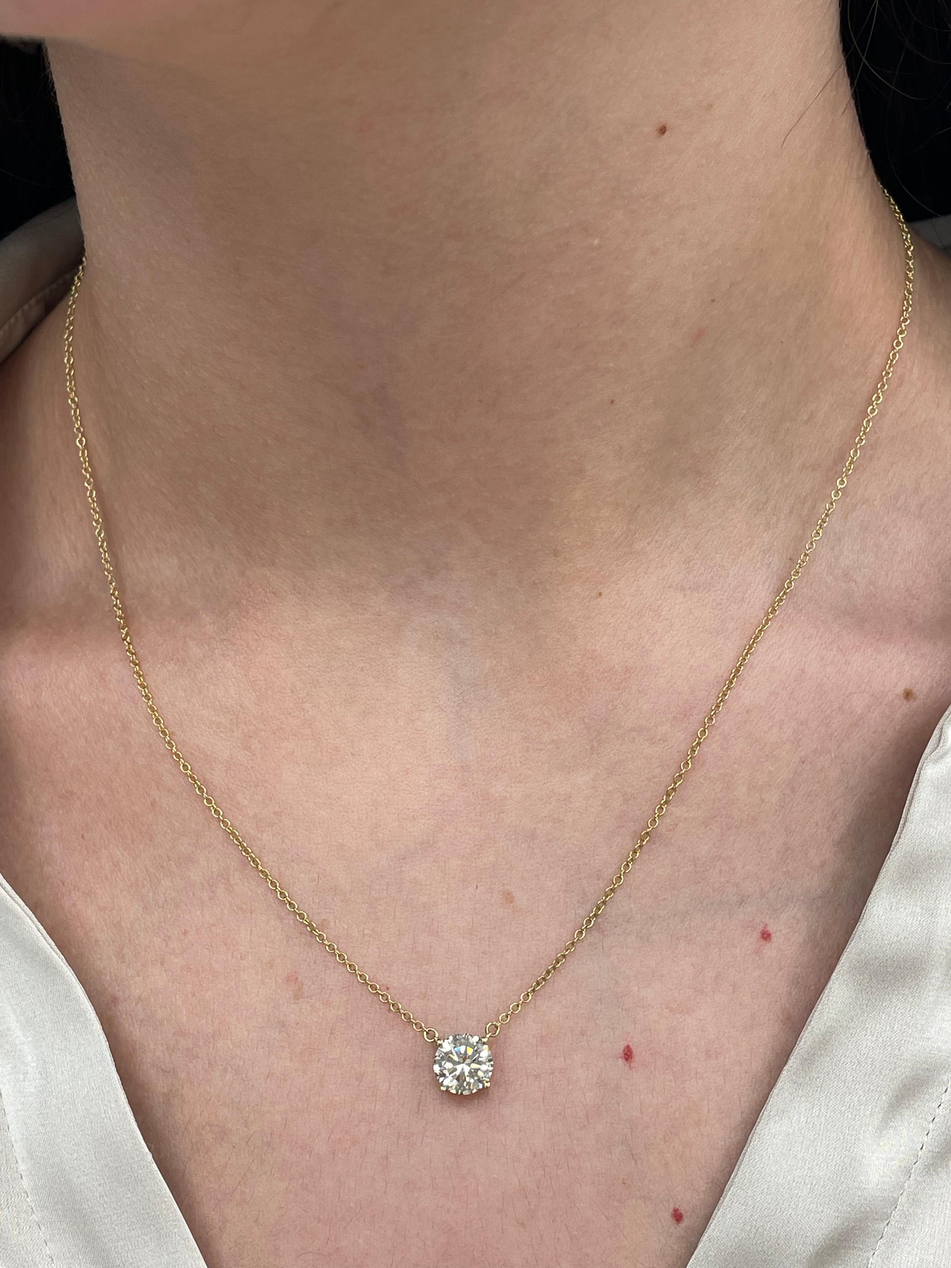 Beautiful classic diamond pendant necklace. Simple, modern, and classic. By Alexander Beverly Hills.
1.51 carat round brilliant cut diamond. Approximately J color grade and SI clarity grade. 14-karat yellow gold, 4.09 grams, 16-18