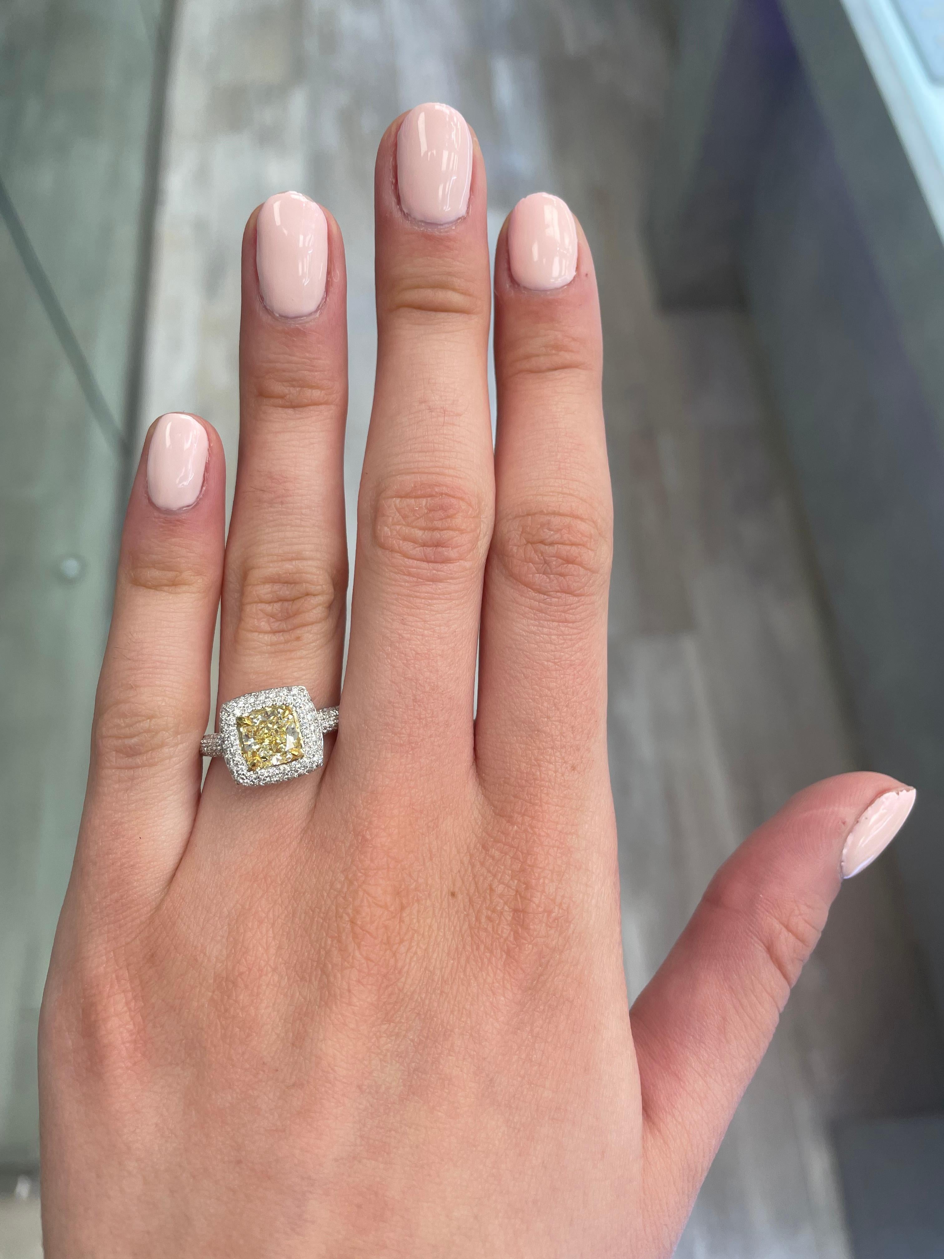 Stunning modern EGL certified yellow diamond with halo ring, two-tone 18k yellow and white gold. By Alexander Beverly Hills
2.14 carats total diamond weight.
1.51 carat radiant cut Fancy Intense Yellow color and VS2 clarity diamond, EGL graded.