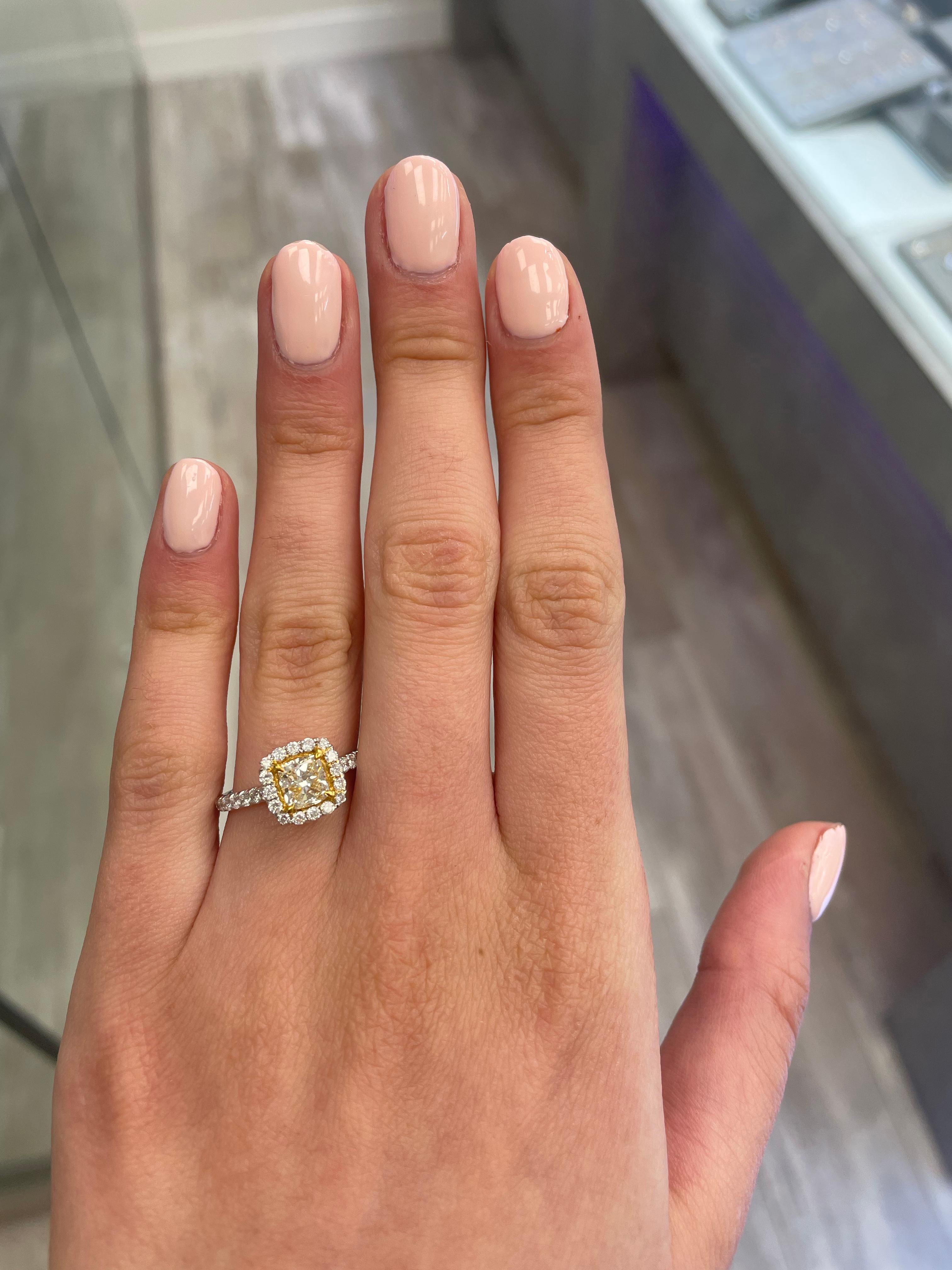 Stunning modern EGL certified yellow diamond with halo ring, two-tone 18k yellow and white gold. By Alexander Beverly Hills
1.51 carats total diamond weight.
1.02 carat cushion cut Fancy Yellow color and VS1 clarity diamond, EGL graded. Complimented