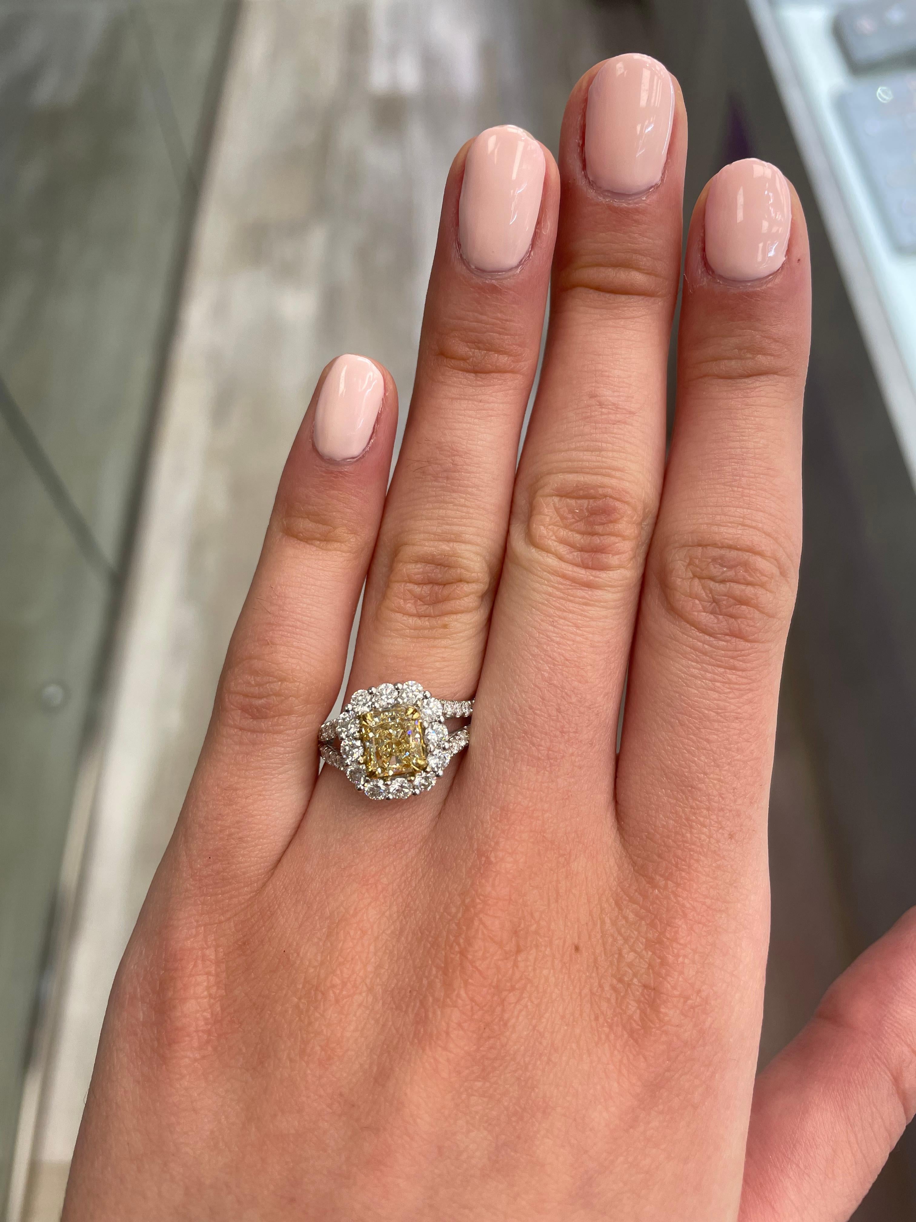 Stunning modern EGL certified yellow diamond with halo ring, two-tone 18k yellow and white gold, split shank. By Alexander Beverly Hills
2.77 carats total diamond weight.
1.52 carat radiant cut Fancy Intense Yellow color and VS2 clarity diamond, EGL