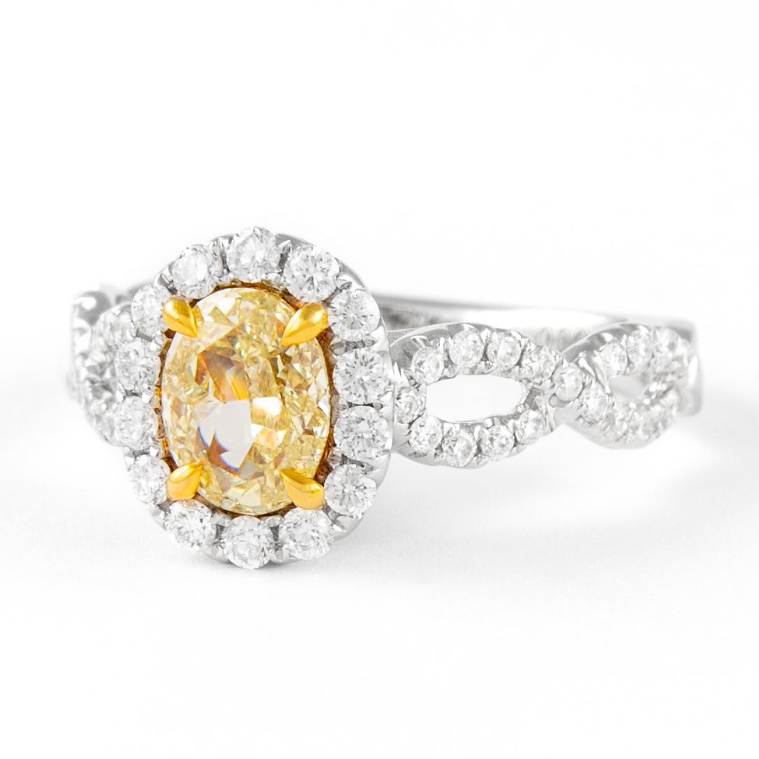 Stunning modern EGL certified yellow diamond with halo ring, two-tone 18k yellow and white gold, split shank. By Alexander Beverly Hills
1.56 carats total diamond weight.
1.00 carat oval cut Fancy Intense Yellow color and SI3 clarity diamond, GIA