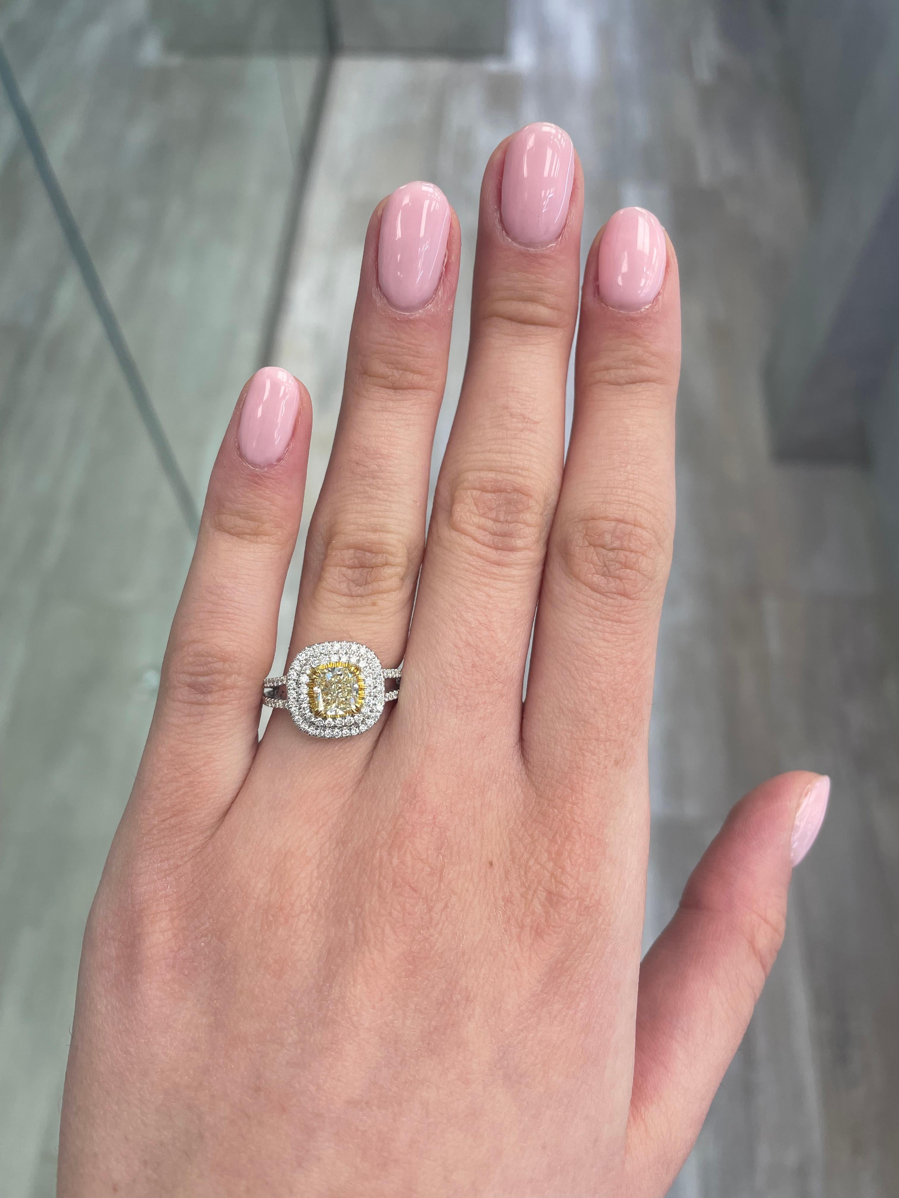 Stunning modern EGL certified yellow diamond double halo ring, two-tone 18k yellow and white gold, split shank. By Alexander Beverly Hills
1.58 carats total diamond weight.
1.06 carat cushion cut Fancy Yellow color and VS2 clarity diamond, EGL