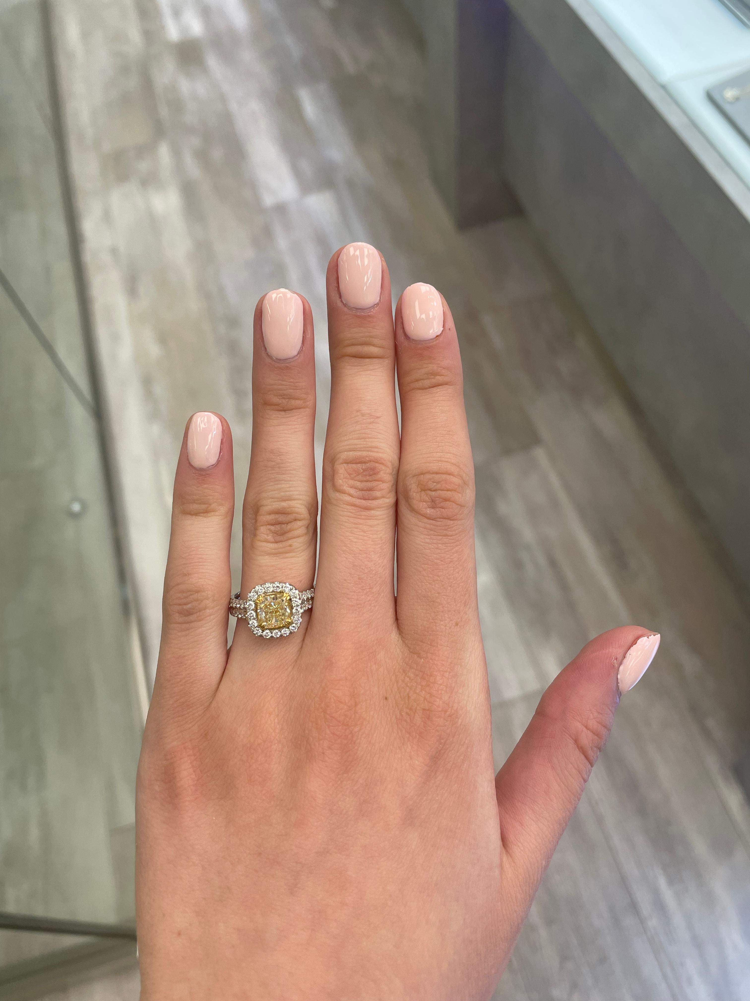 Stunning modern EGL certified yellow diamond with halo ring, two-tone 18k yellow and white gold. By Alexander Beverly Hills
2.67 carats total diamond weight.
1.60 carat cushion cut Fancy Intense Yellow color and VS1 clarity diamond, EGL graded.