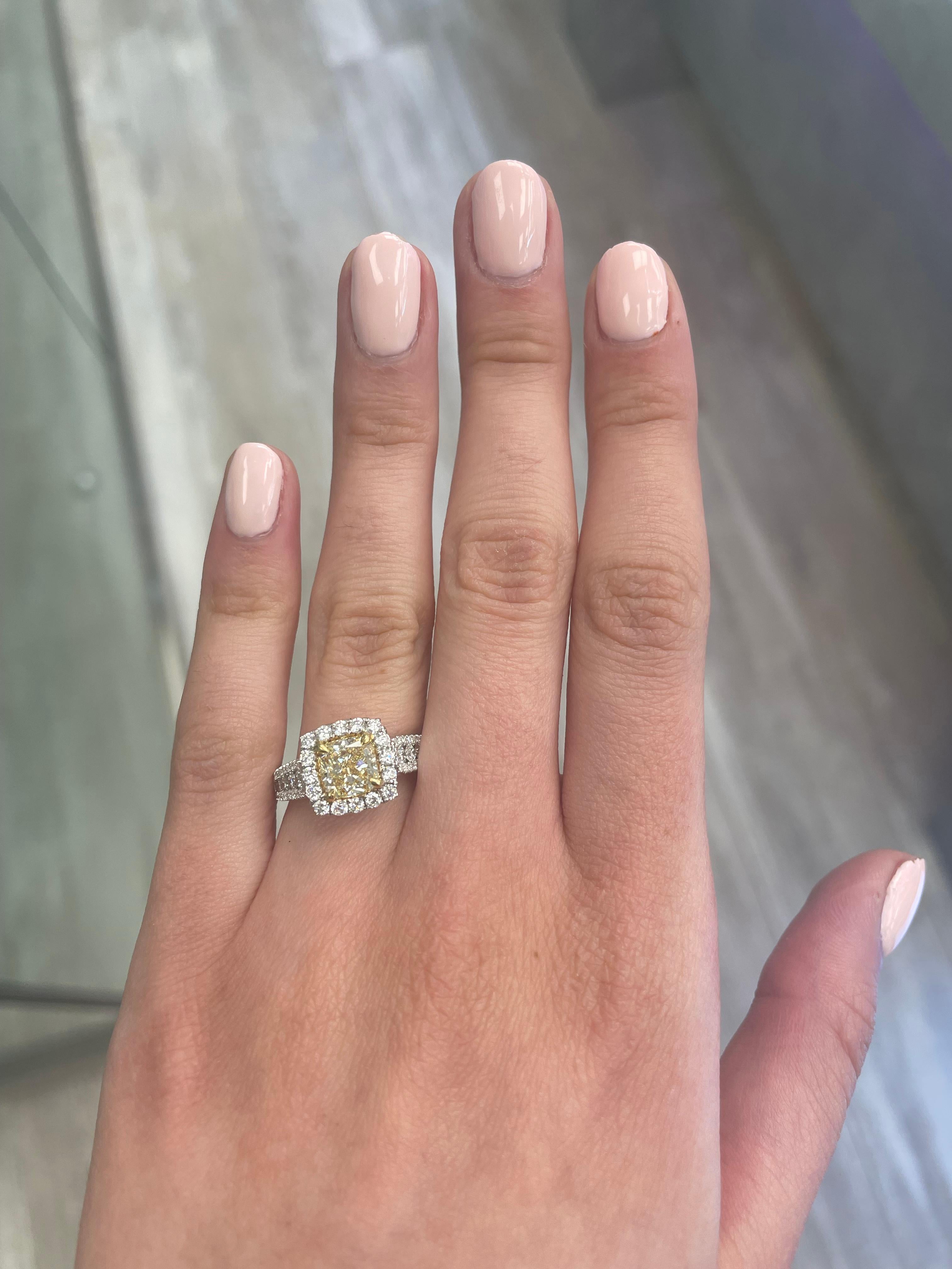 Stunning modern EGL certified yellow diamond with halo ring, two-tone 18k yellow and white gold. By Alexander Beverly Hills
2.47 carats total diamond weight.
1.61 carat cushion cut Fancy Intense Yellow color and VS1 clarity diamond, EGL graded.
