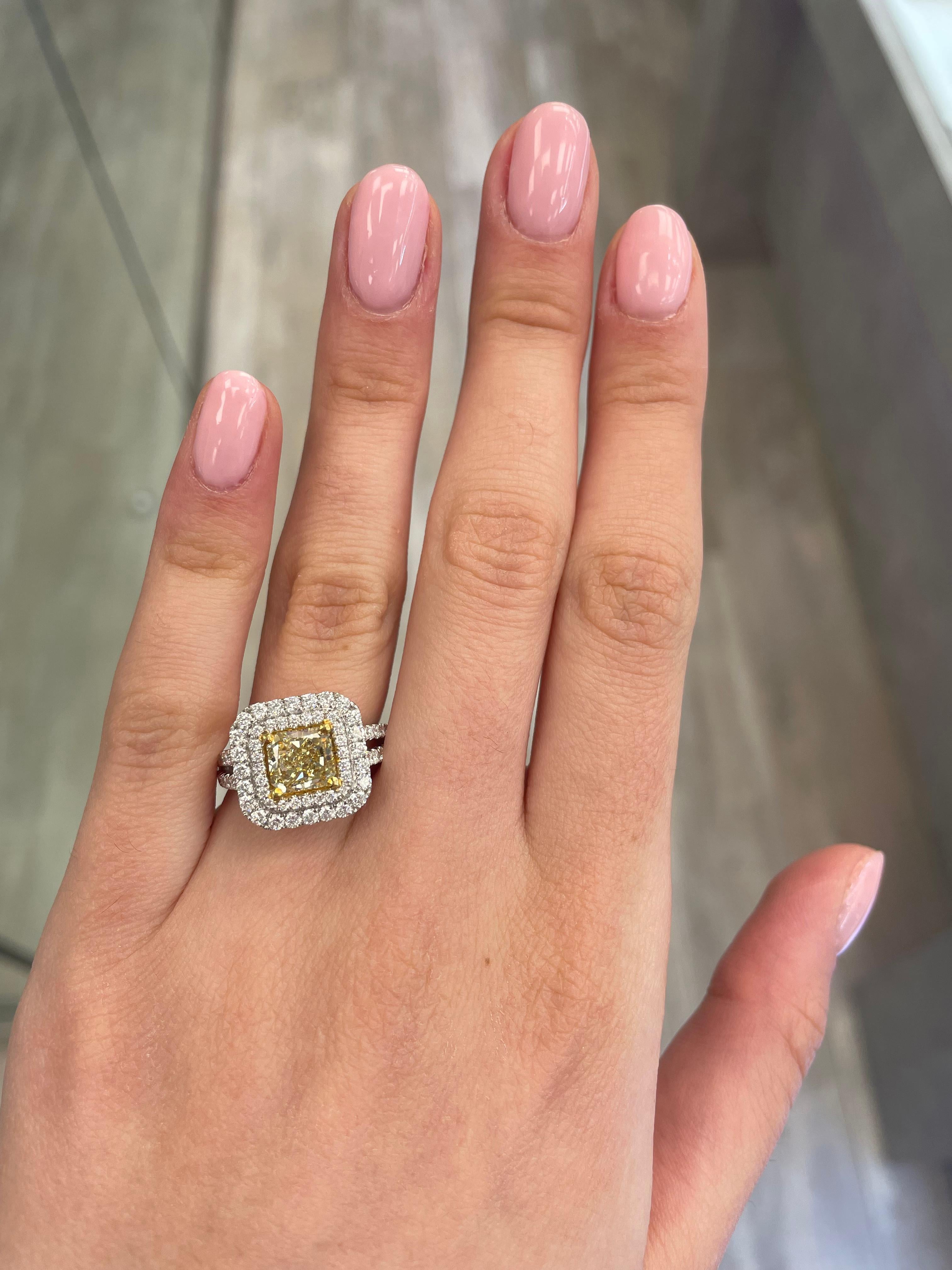 Stunning modern EGL certified fancy intense yellow diamond double halo ring, two-tone 18k yellow and white gold, split shank. By Alexander Beverly Hills
2.88 carats total diamond weight.
1.62 carat radiant cut Fancy Intense Yellow color and SI1