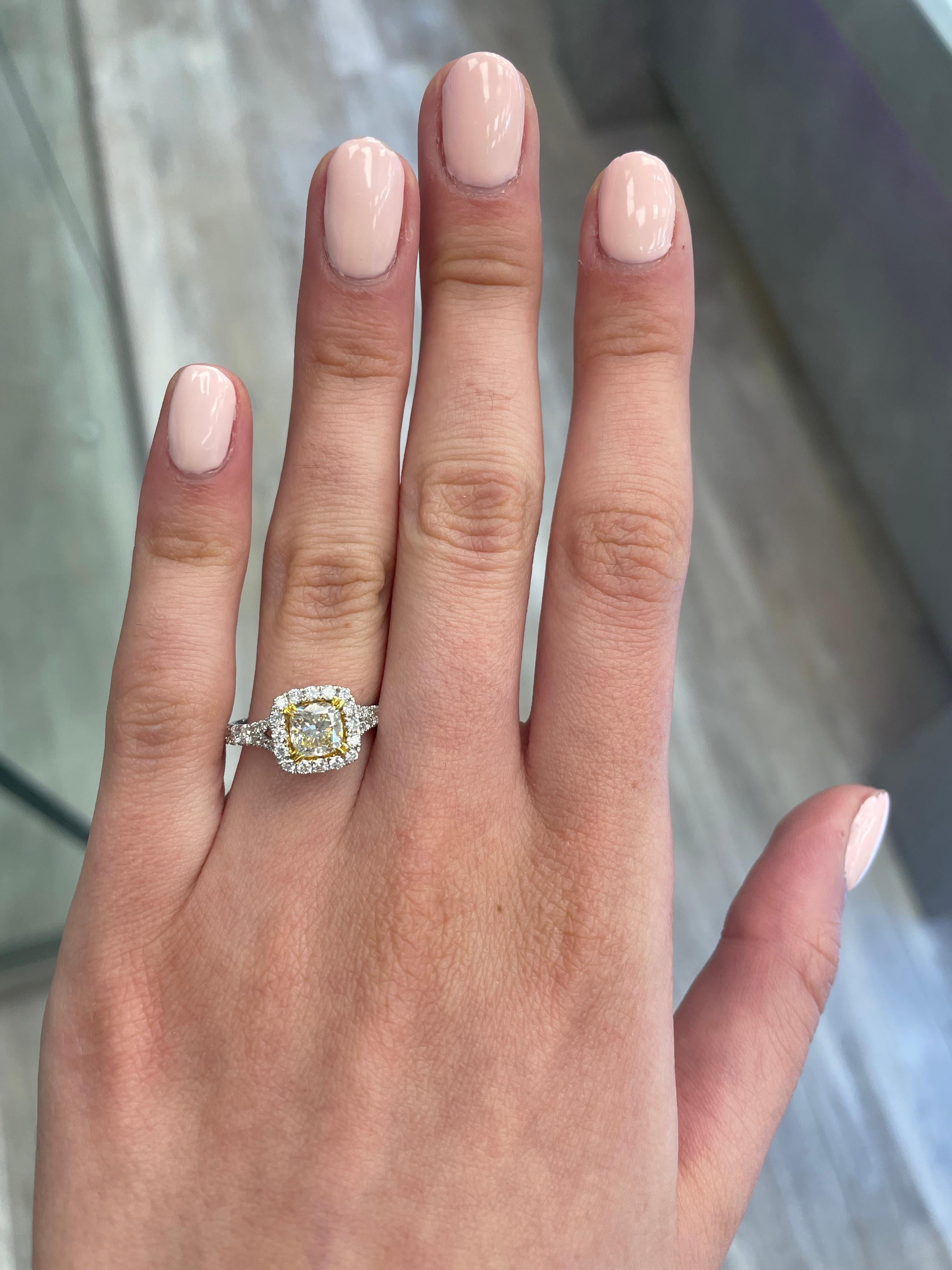 Stunning modern EGL certified yellow diamond with halo ring, two-tone 18k yellow and white gold. By Alexander Beverly Hills
1.63 carats total diamond weight.
1.04 carat cushion cut Fancy Yellow color and VS1 clarity diamond, EGL graded. Complimented