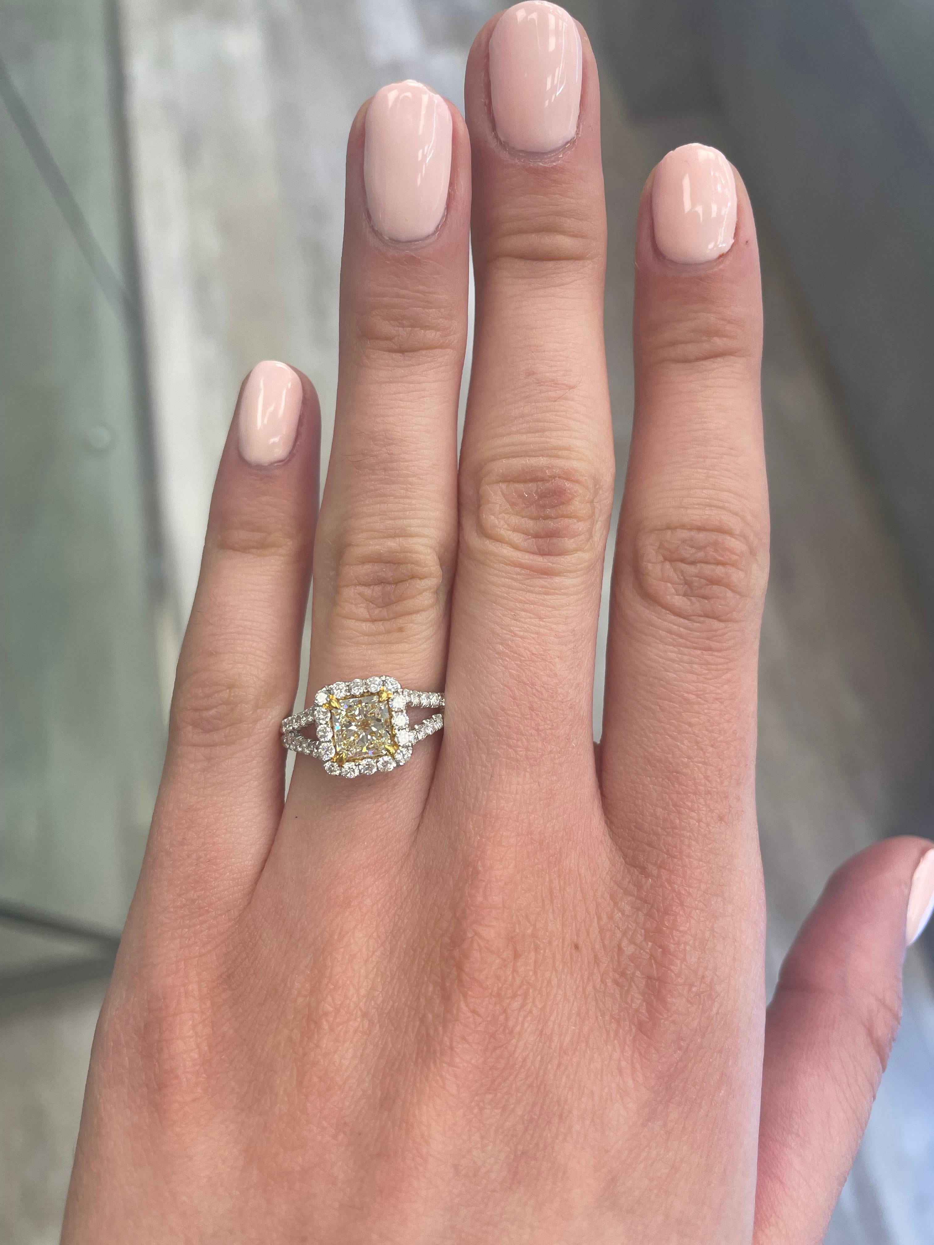 Stunning modern EGL certified yellow diamond with halo ring, two-tone 18k yellow and white gold. By Alexander Beverly Hills
1.70 carats total diamond weight.
1.11 carat radiant cut Fancy Light Yellow color and VVS2 clarity diamond, EGL graded.