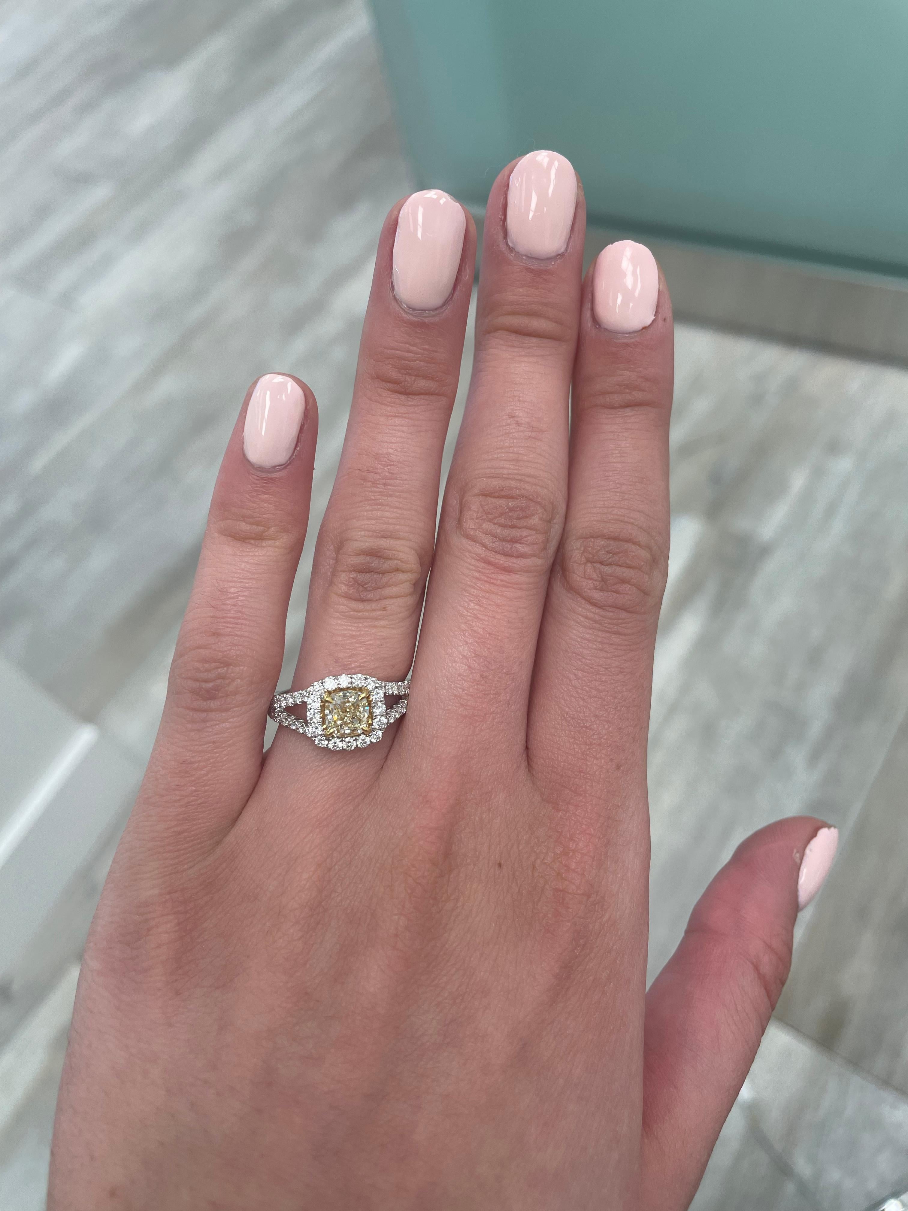 Stunning modern EGL certified yellow diamond with halo ring, two-tone 18k yellow and white gold. By Alexander Beverly Hills
1.72 carats total diamond weight.
1.05 carat cushion cut Fancy Yellow color and VS1 clarity diamond, EGL graded. Complimented