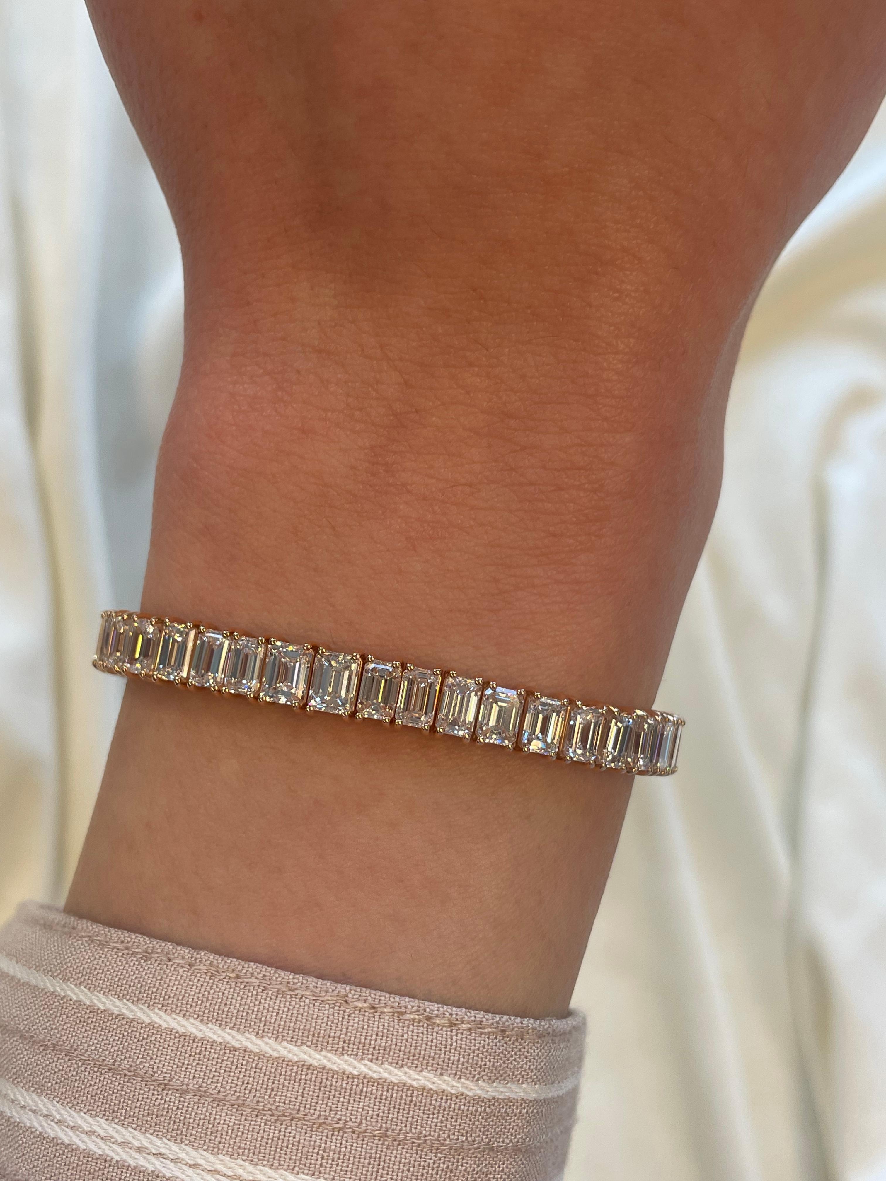 Stunning modern straight emerald cut diamond tennis bracelet. High jewelry by Alexander Beverly Hills.
51 emerald cut diamonds, 17.32 carats (apx 0.33ct each). Approximately H/I color and VVS-VS clarity. 18k rose gold, 19.48 grams.
Accommodated with