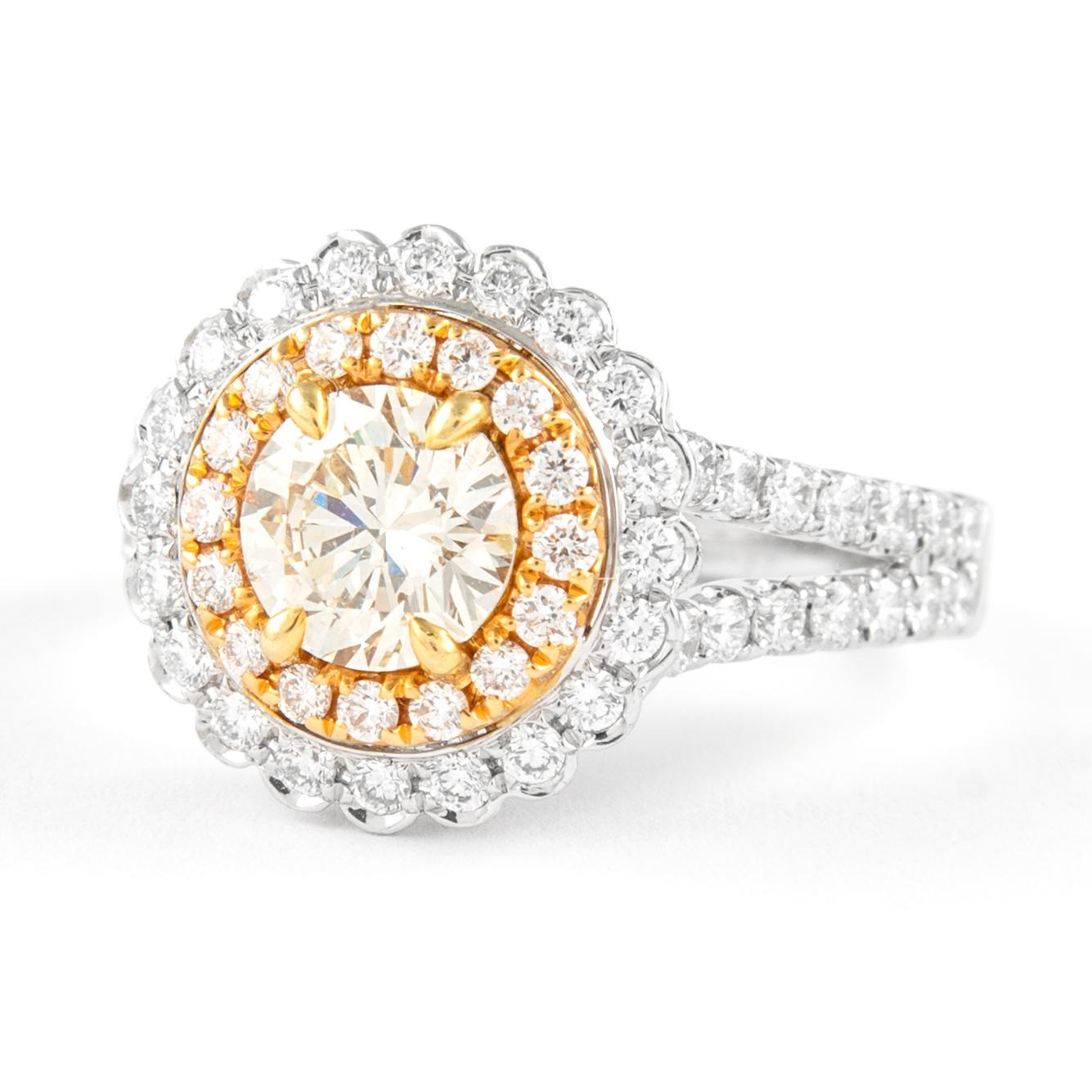 Stunning modern EGL certified yellow diamond double halo ring, two-tone 18k yellow and white gold, split shank. By Alexander Beverly Hills.
1.78 carats total diamond weight.
0.96 carat round brilliant Light Yellow color and SI2 clarity diamond, EGL