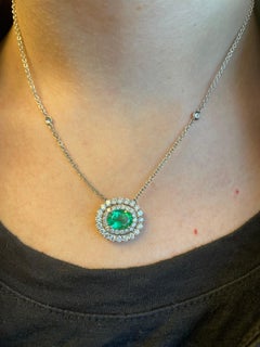 Alexander 1.79ct Oval Emerald with Diamond Halo 18k White Gold Pendant Necklace