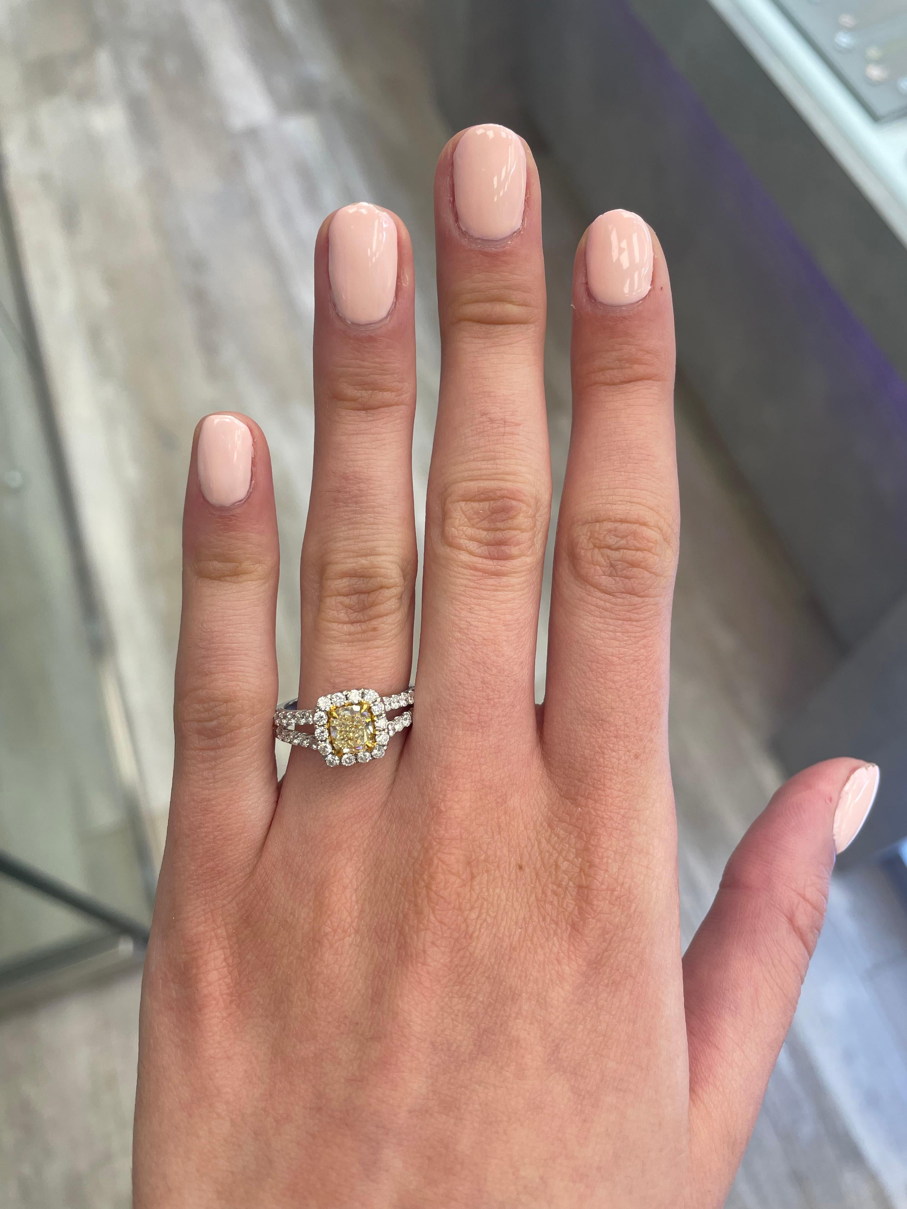 Stunning modern EGL certified yellow diamond with halo ring, two-tone 18k yellow and white gold, split shank. By Alexander Beverly Hills
1.79 carats total diamond weight.
1.01 carat cushion cut Fancy Yellow color and VS1 clarity diamond, EGL graded.