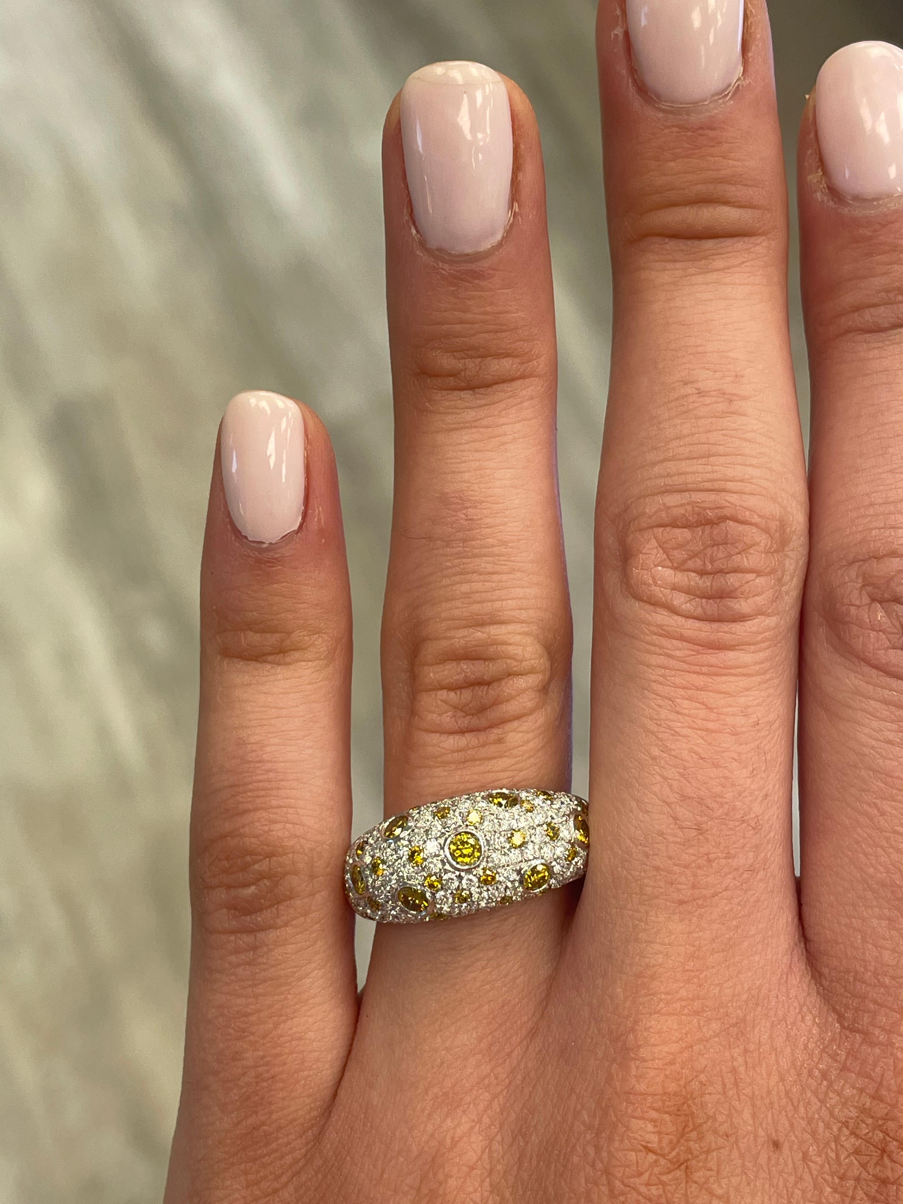 Stunning green yellow multi shape diamond cocktail ring, by Alexander Beverly Hills.
1.05 carats of Fancy Green Yellow color diamonds. Complimented by 120 round diamonds, 0.81 carats. Approximately G/H color and SI clarity. 18-karat white and yellow