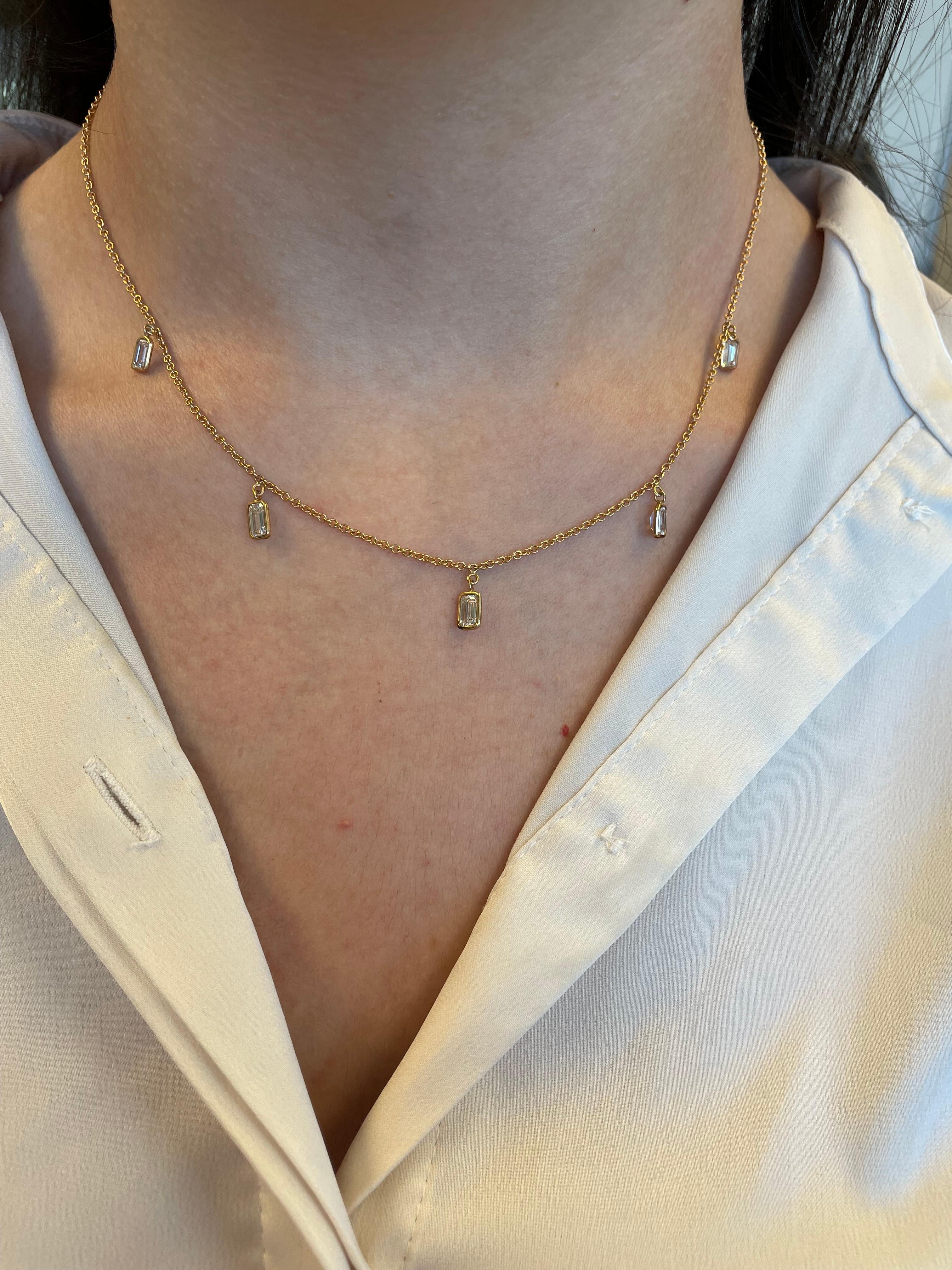Exquisite dangling emerald cut diamonds by the yard modern necklace. By Alexander Beverly Hills.
5 emerald cut diamonds, 1.93 carats total. Approximately G/H color and VS clarity. Bezel set in 18k rose gold. 
Accommodated with an up-to-date