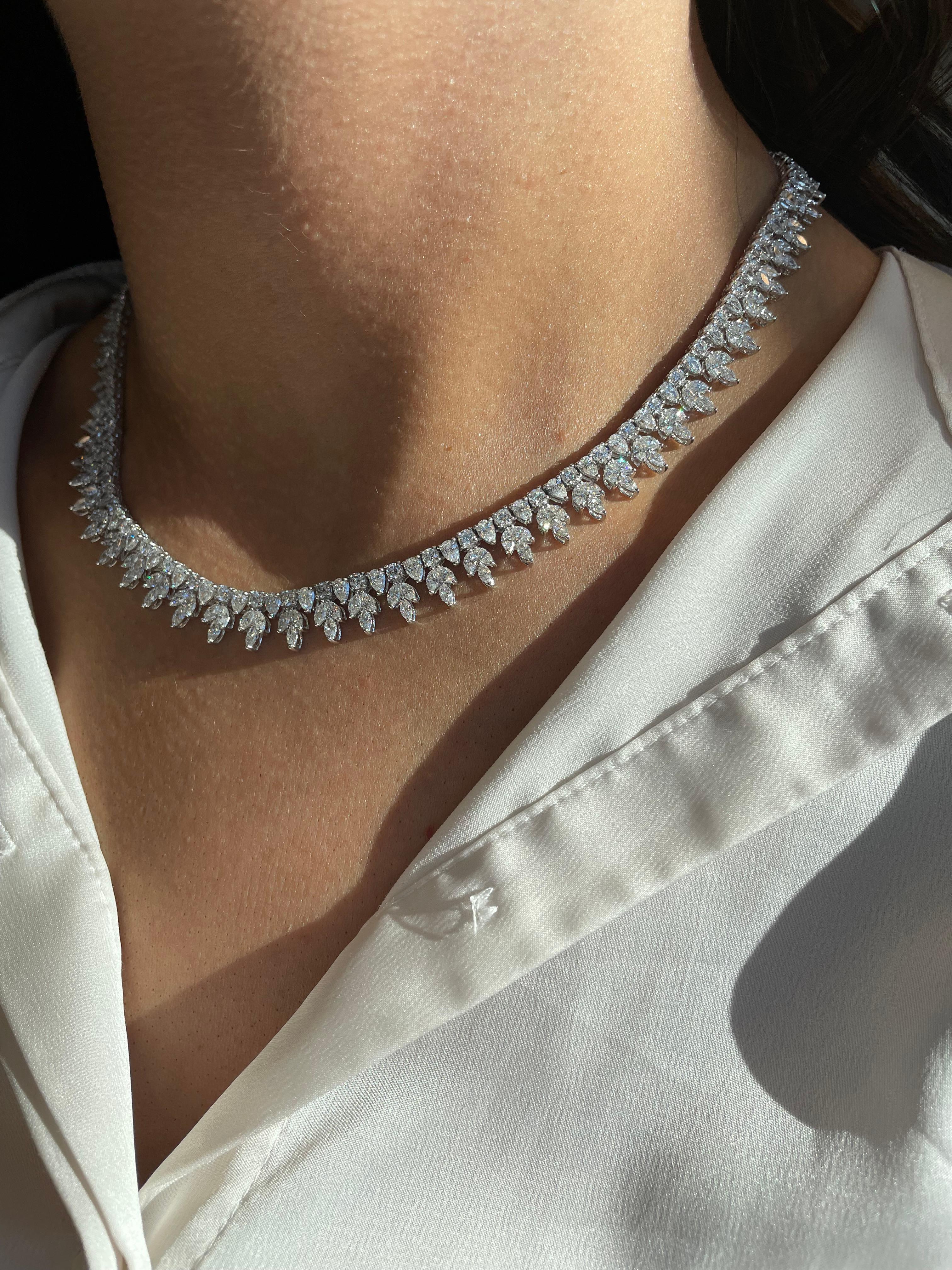 Exquisite multi diamond necklace. Perfect as a wedding / bridal necklace. High jewelry by Alexander Beverly Hills.
335 round, marques, and pear cut diamonds, 19.74 carats total. Approximately G/H color and VS clarity. Four prong set in 18k white