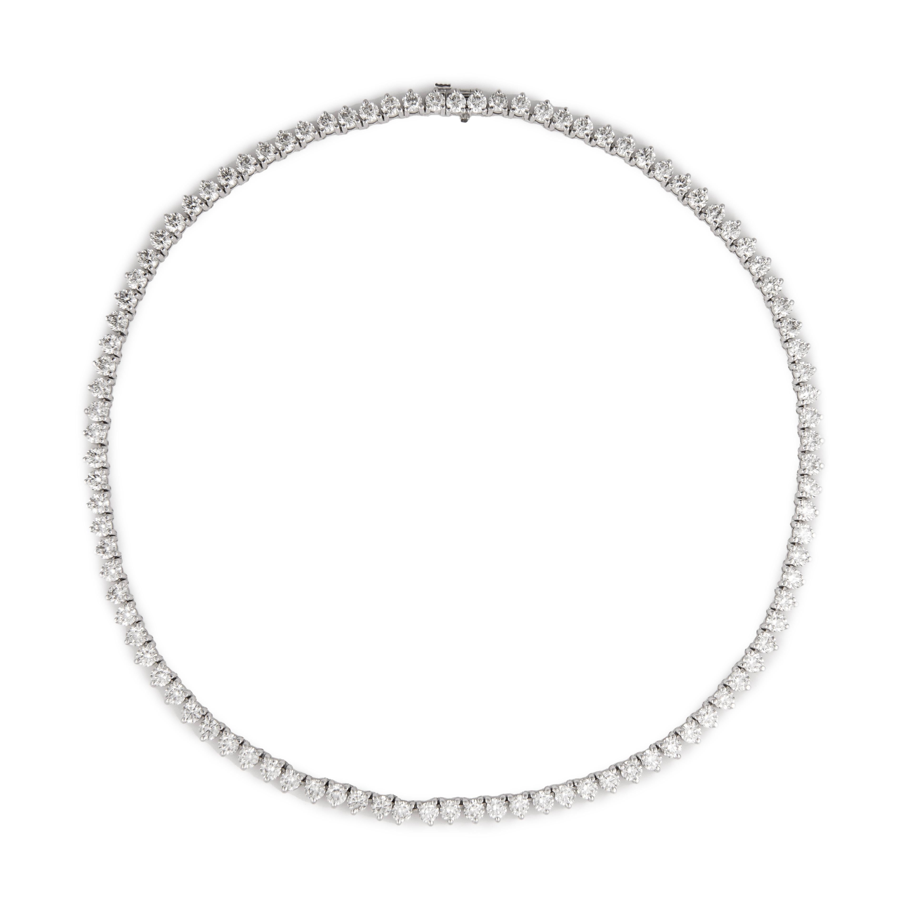Beautiful and classic diamond tennis riviera necklace, by Alexander Beverly Hills.
20.09 carats of round brilliant diamonds, approximately H/I color and VS2/SI1 clarity. Three prong, 18k white gold, 37.27 grams, 16In.
Accommodated with an up-to-date