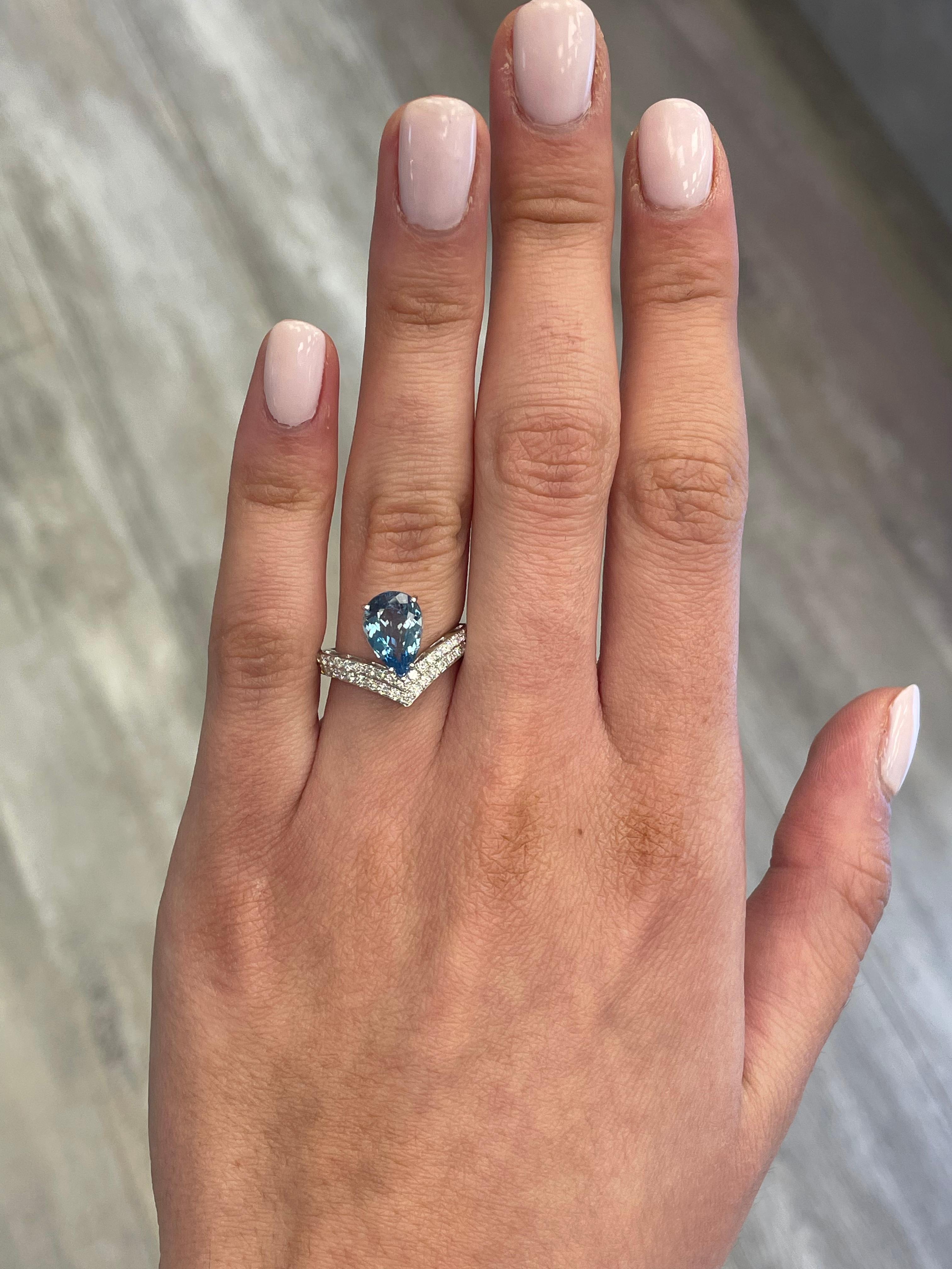Stunning aquamarine and diamond ring, by Alexander Beverly Hills.
1 pear aquamarine, 1.60 carats. Complimented by 42 round brilliant diamonds, 0.42 carats. Approximately D-F color and SI clarity. 18-karat white gold, 3.65 grams, 5.75 ring