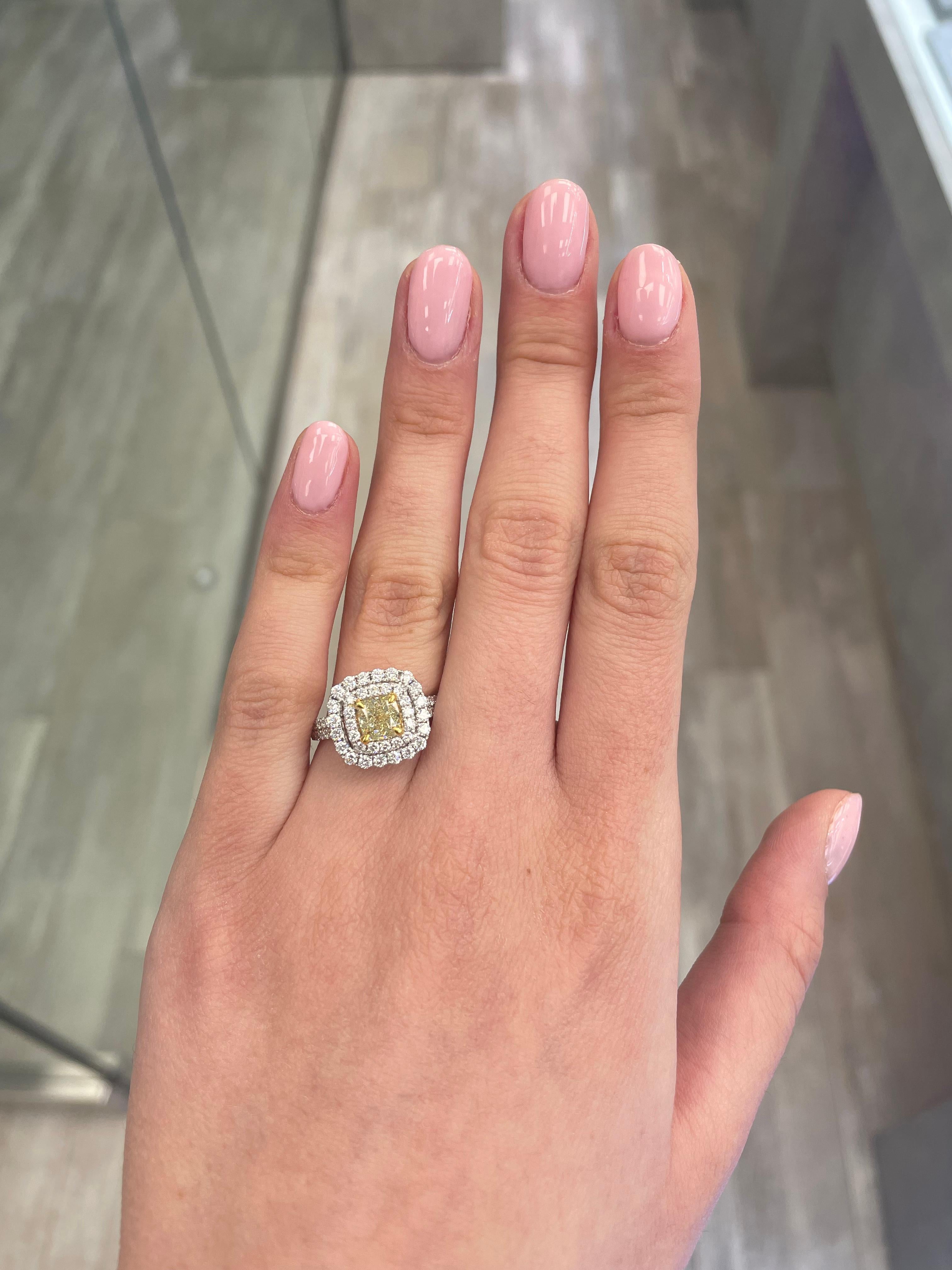 Stunning modern EGL certified yellow diamond double halo ring, two-tone 18k yellow and white gold. By Alexander Beverly Hills
2.08 carats total diamond weight.
1.11 carat cushion cut Fancy Yellow color and VS1 clarity diamond, EGL graded.