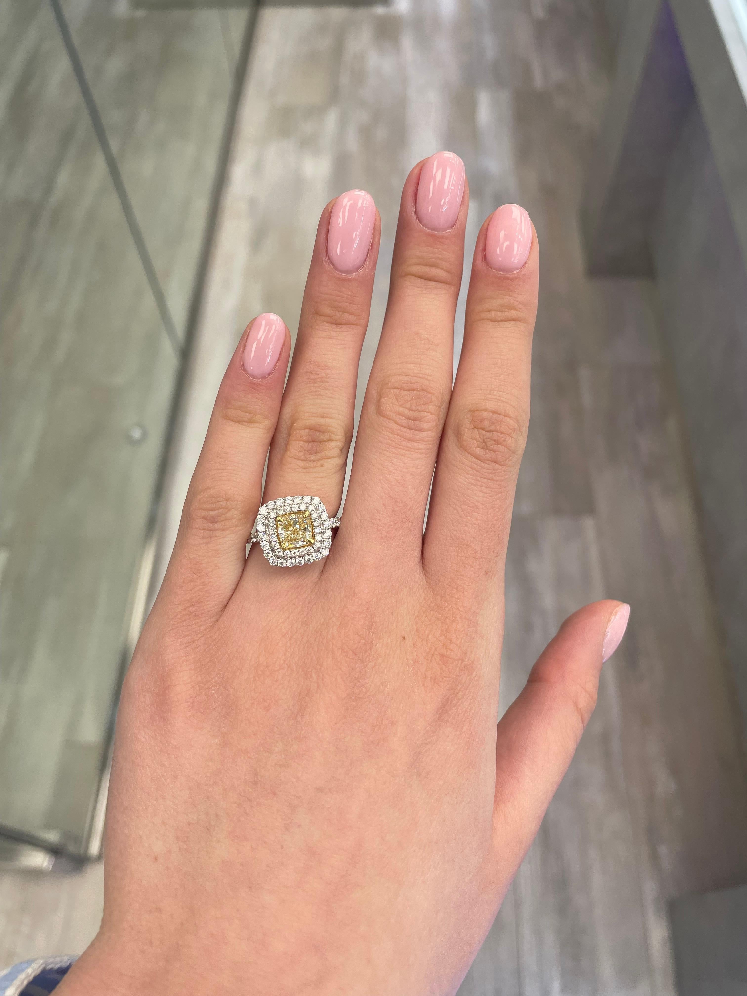 Stunning modern EGL certified yellow diamond double halo ring, two-tone 18k yellow and white gold. By Alexander Beverly Hills
2.10 carats total diamond weight.
1.33 carat cushion cut Fancy Intense Yellow color and VS2 clarity diamond, EGL graded in