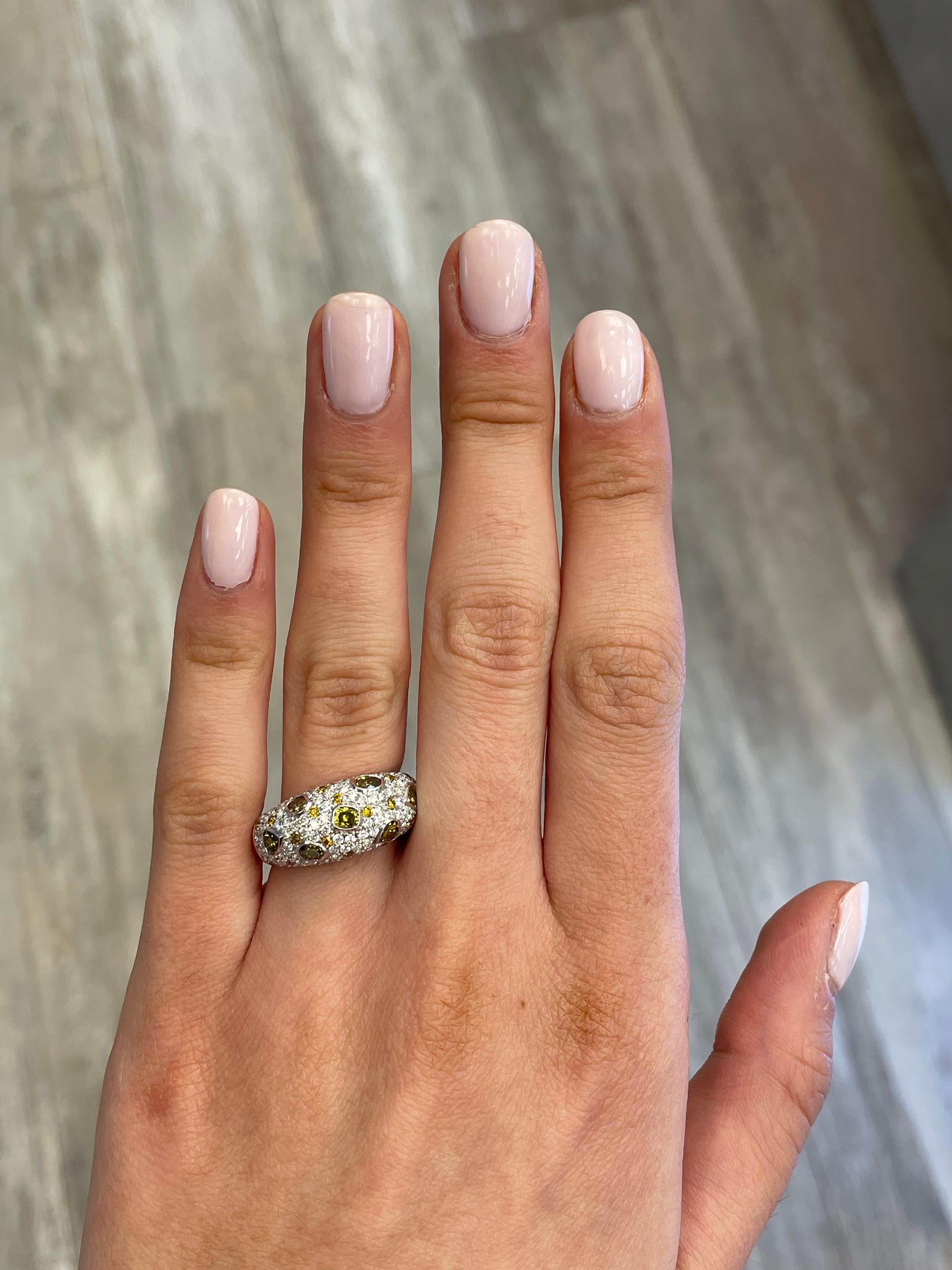 Stunning yellow and brown yellow multi shape diamond cocktail ring, by Alexander Beverly Hills.
1.14 carats of Fancy Yellow and Brown Yellow color diamonds. Complimented by 120 round diamonds, 1.02 carats. Approximately G/H color and SI clarity.