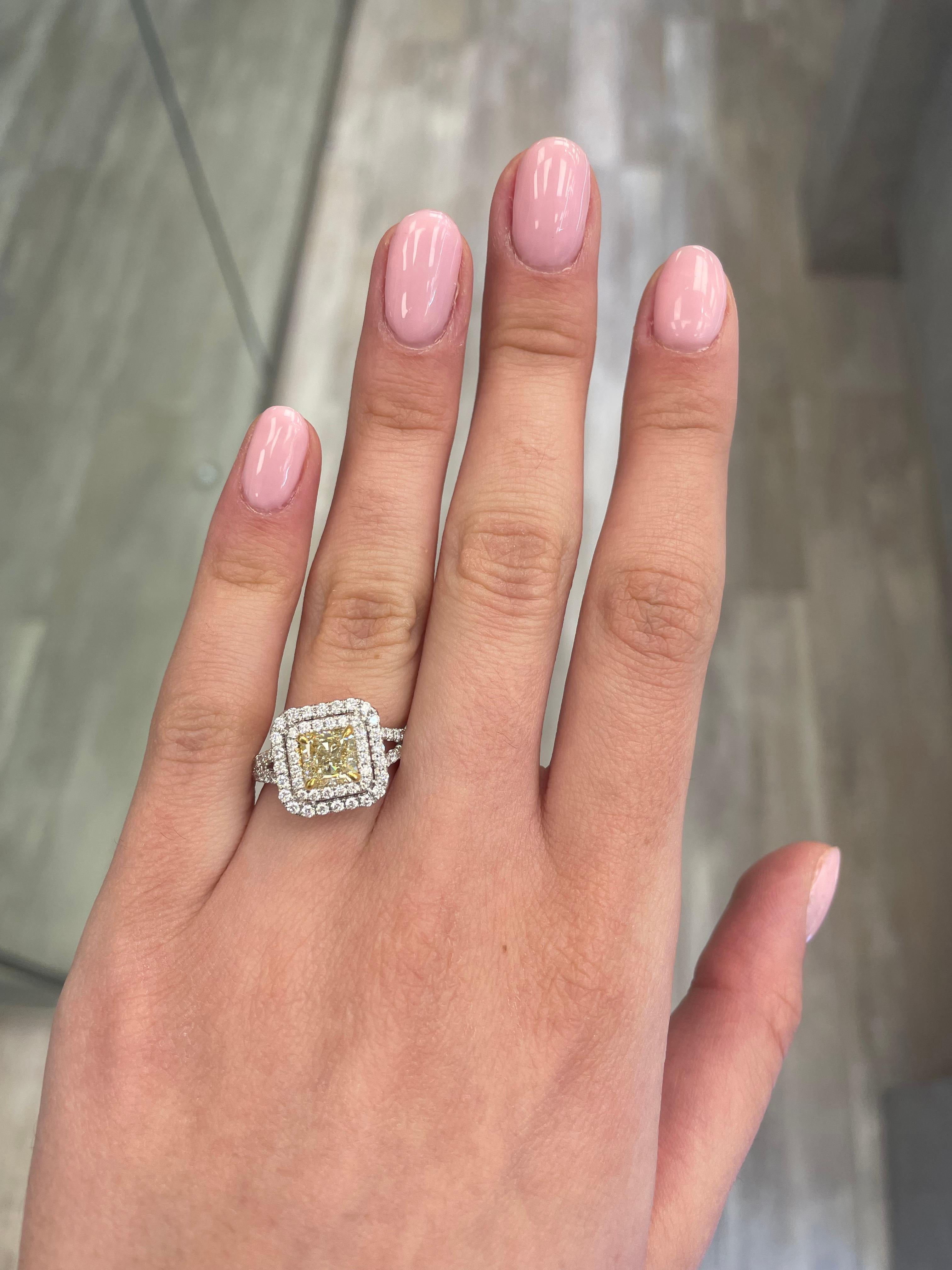 Stunning modern EGL certified fancy yellow diamond double halo ring, two-tone 18k yellow and white gold, split shank. By Alexander Beverly Hills
2.25 carats total diamond weight.
1.52 carat radiant cut Fancy Yellow color and VS1 clarity diamond, EGL